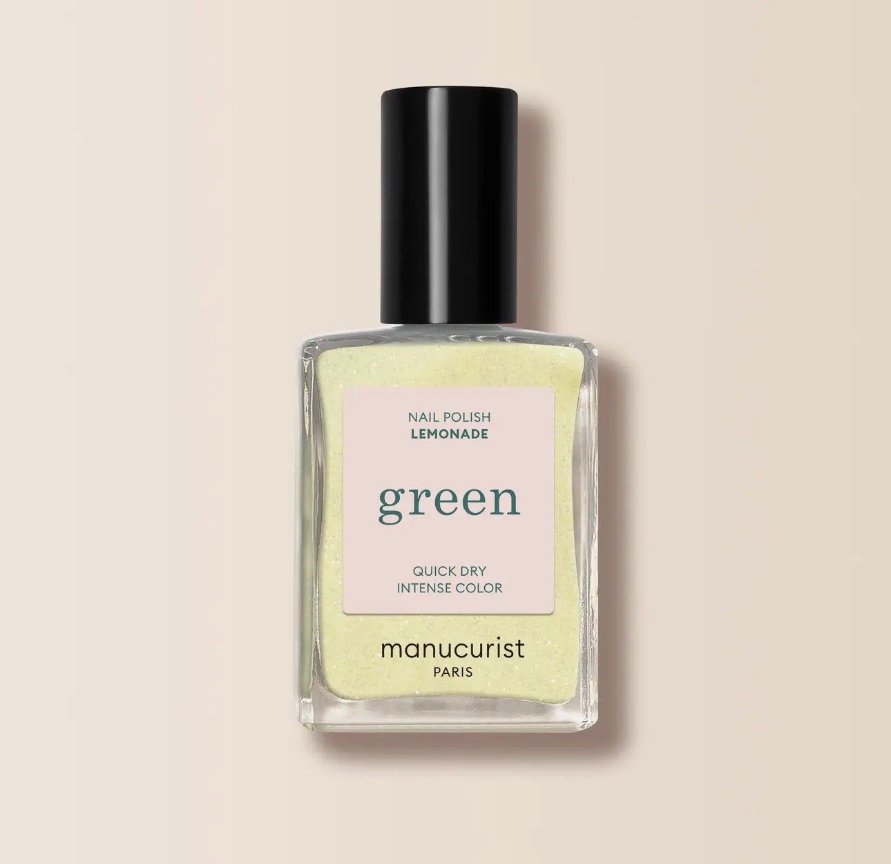 A bottle of Manicurist nail polish labeled 'Lemonade' in green color, with a black cap, on a beige background.
