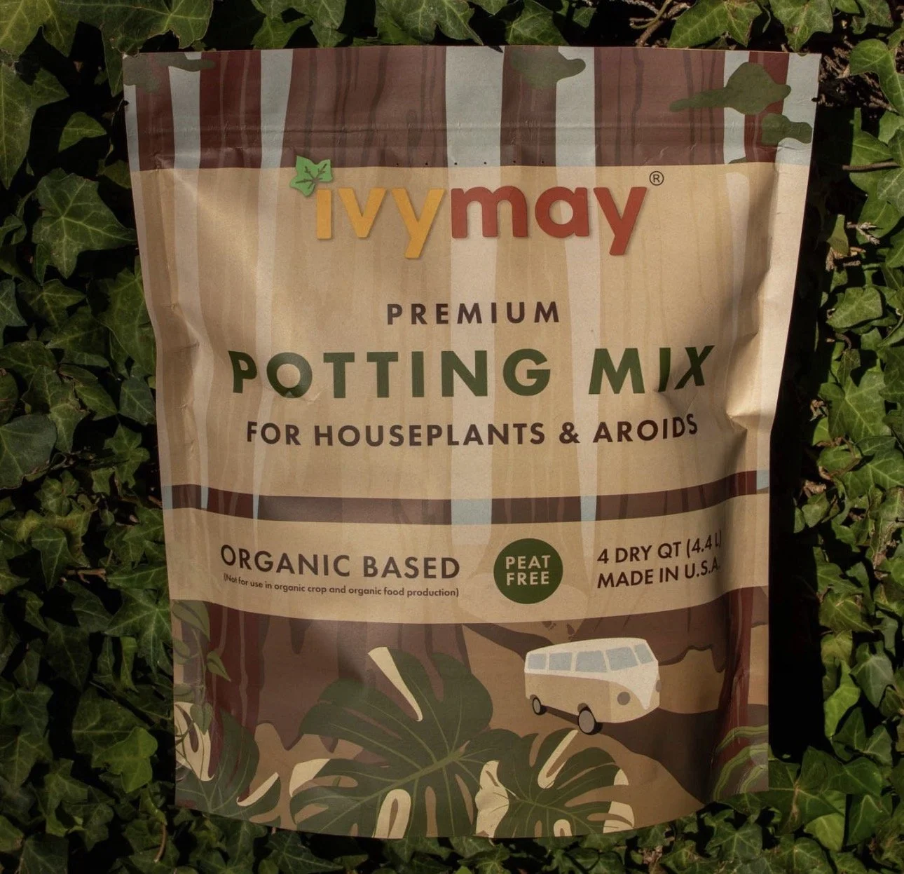 Bag of Ivy May premium potting mix for houseplants and aroids, organic, peat-free, 4.4 liters, made in the U.S., surrounded by green ivy leaves.