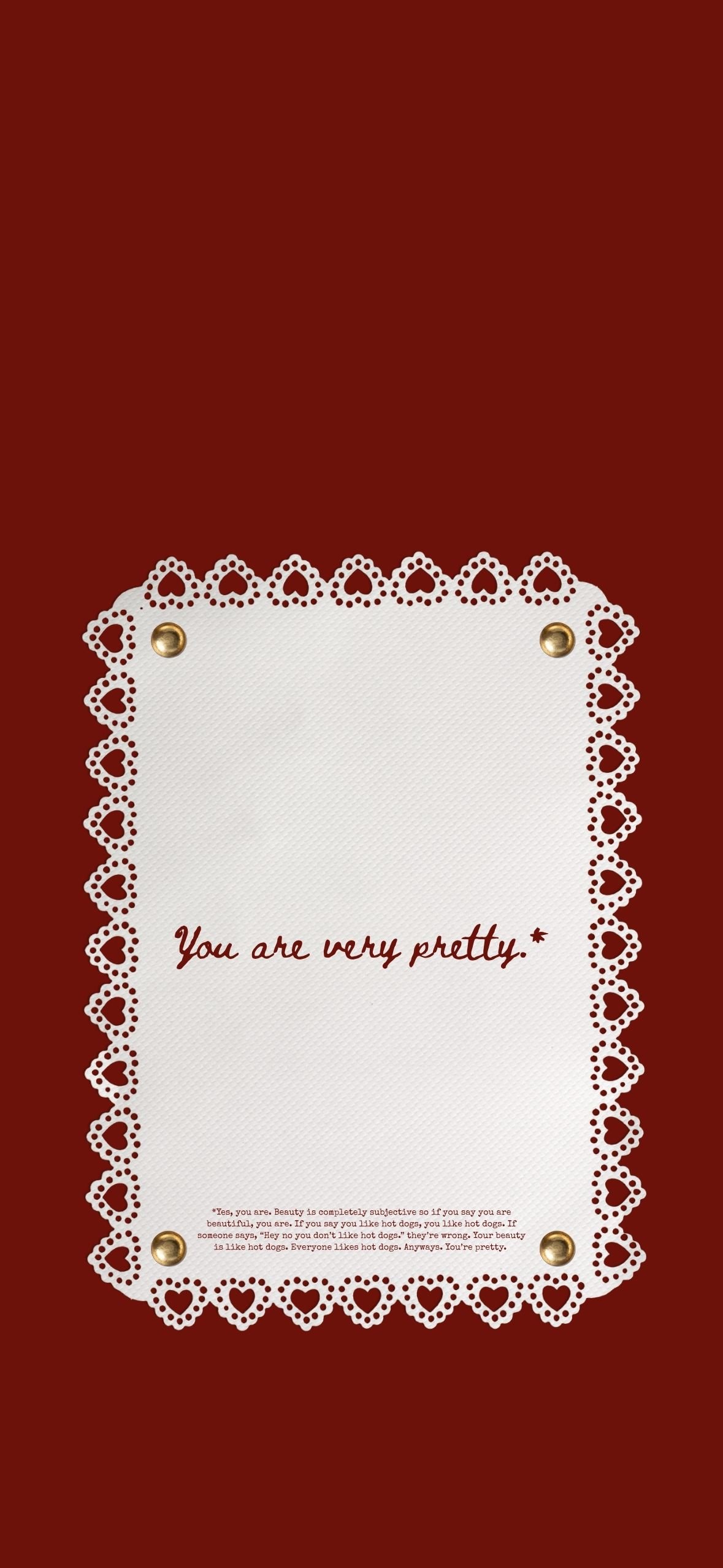 Red aesthetic phone wallpaper featuring white lace heart border with handwritten you are very pretty beauty affirmation quote
