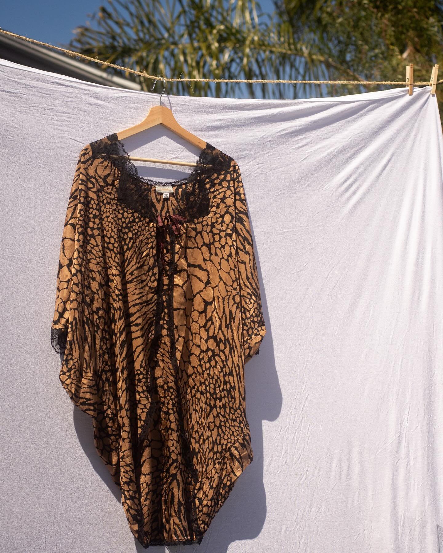 Add a touch of vintage luxury to your next vacation. 🐆🌴 The Christian Dior Silk Cover Up is available now. 🤎 Link in bio.