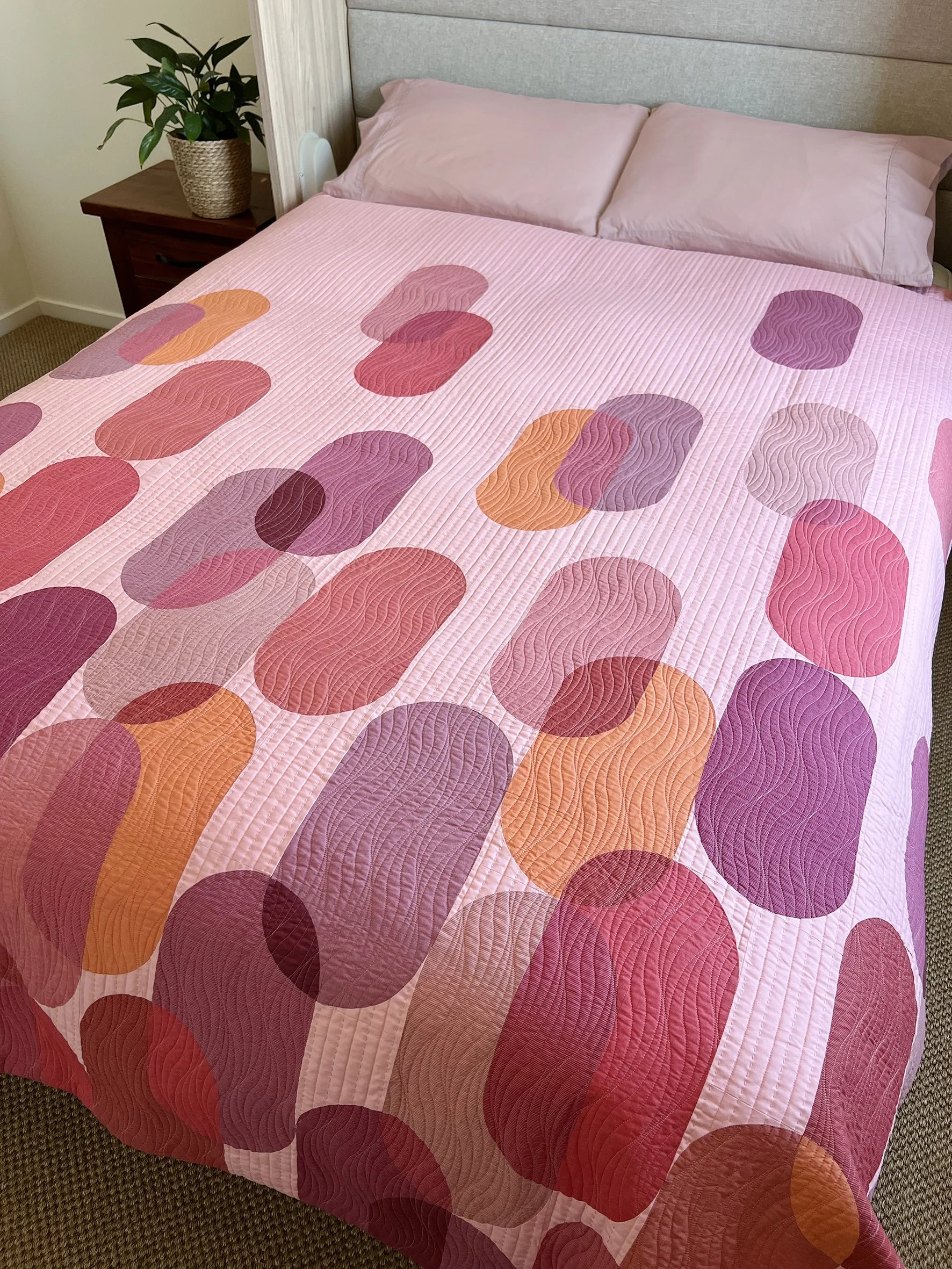 Surfacing quilt on bed.jpg