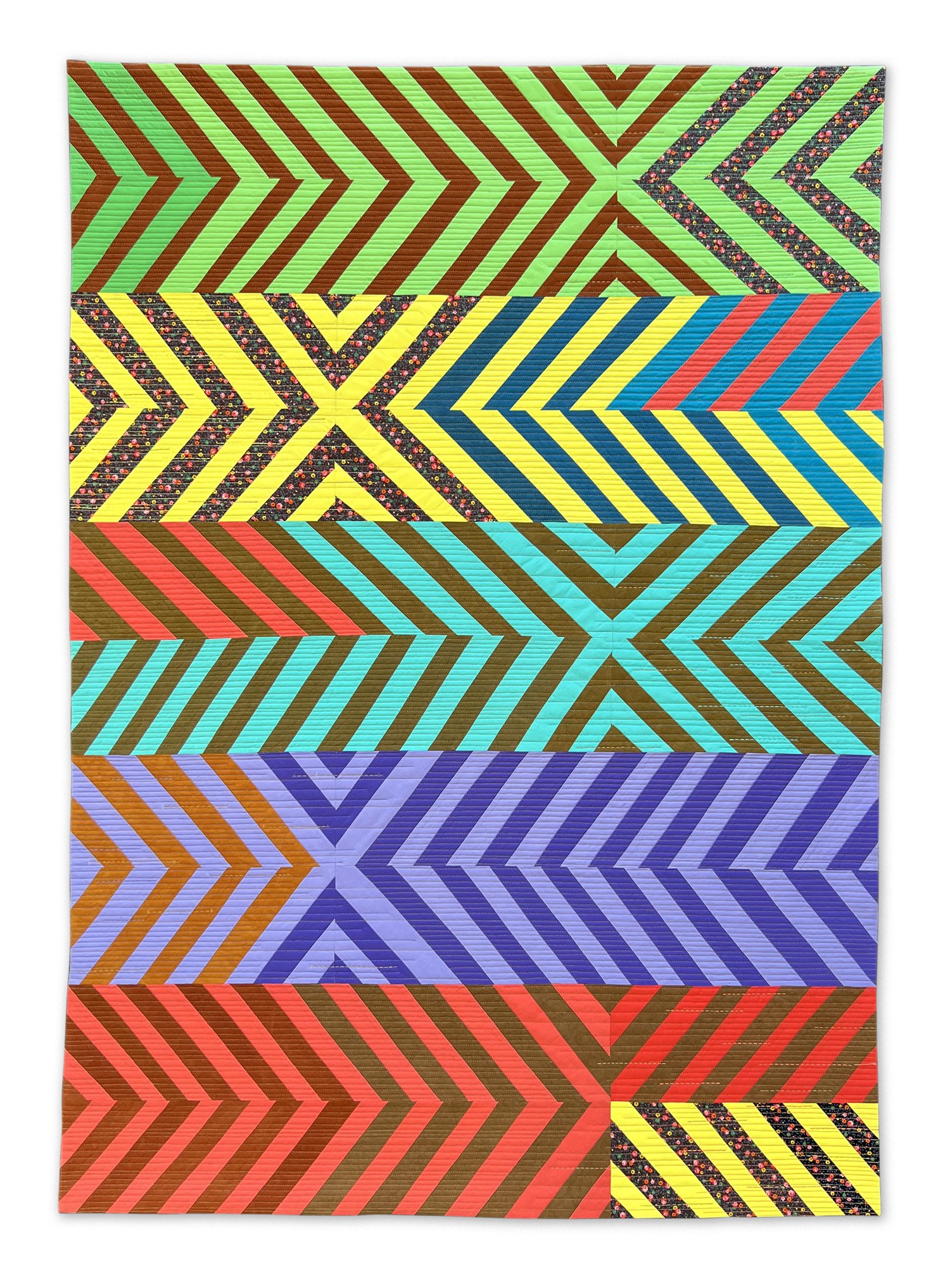 Colourful modern quilt with bands of stripes in an X pattern