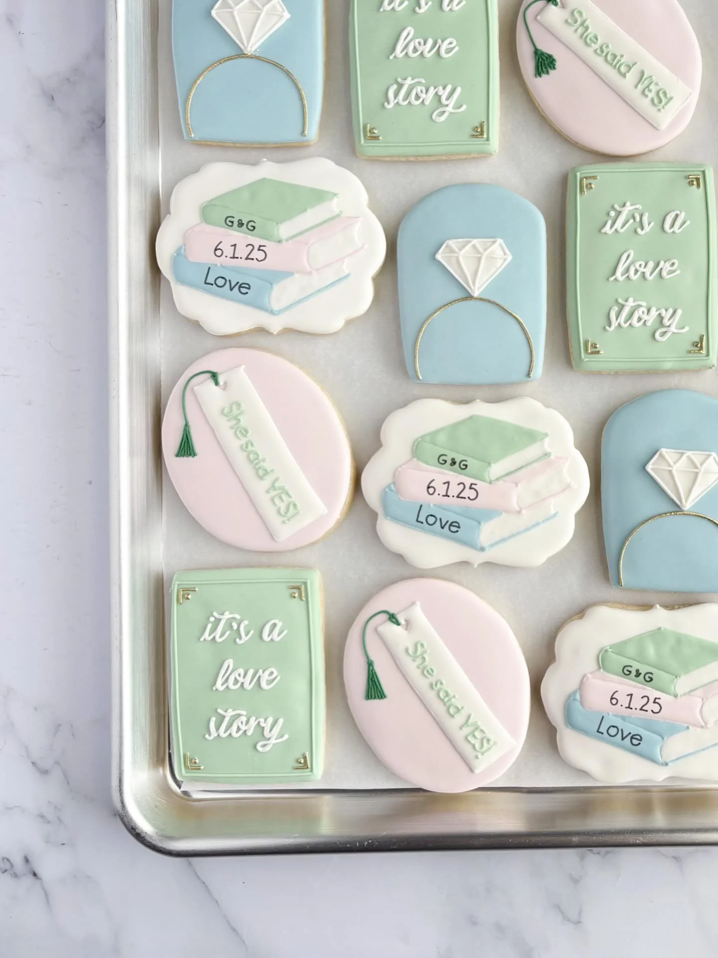 💕 𝐼𝓉&rsquo;𝓈 𝒶 𝓁𝑜𝓋𝑒 𝓈𝓉𝑜𝓇𝓎 📖 

A look back at these beautiful book theme bridal shower cookies! 
.
.
.
.
.
.
.
#decoratedcookies #sugarcookies #bridalshowercookies #lovestory #bridalshowercookies #dmvfoodie #dmvcookies #cookiesofarlingt