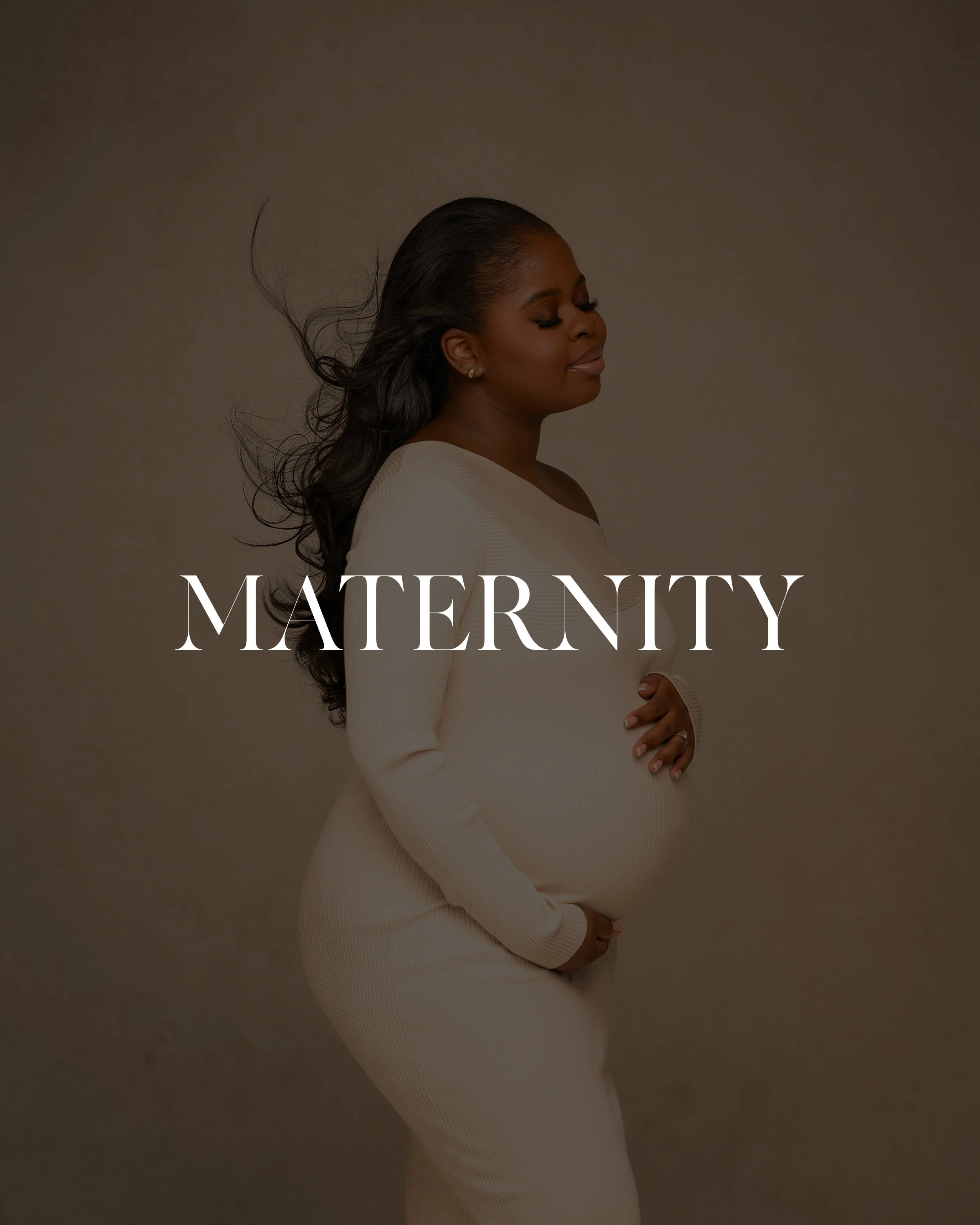 A pregnant woman with long dark hair in a white outfit gently holding her belly, with closed eyes and a peaceful expression, against a neutral background, with the word 'MATERNITY' overlaid.