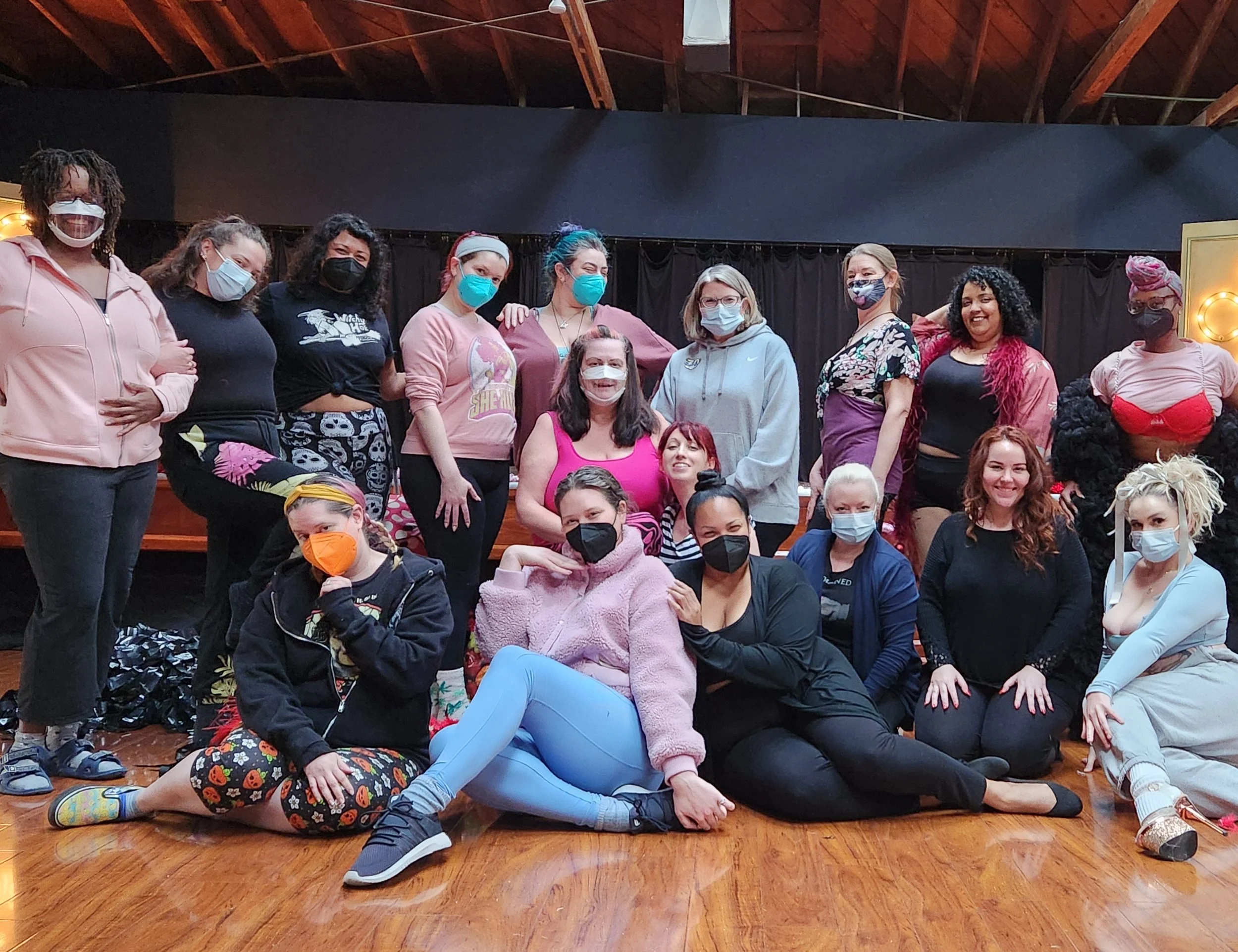 Group of dancers pose for class photo many wear Covid safe masks