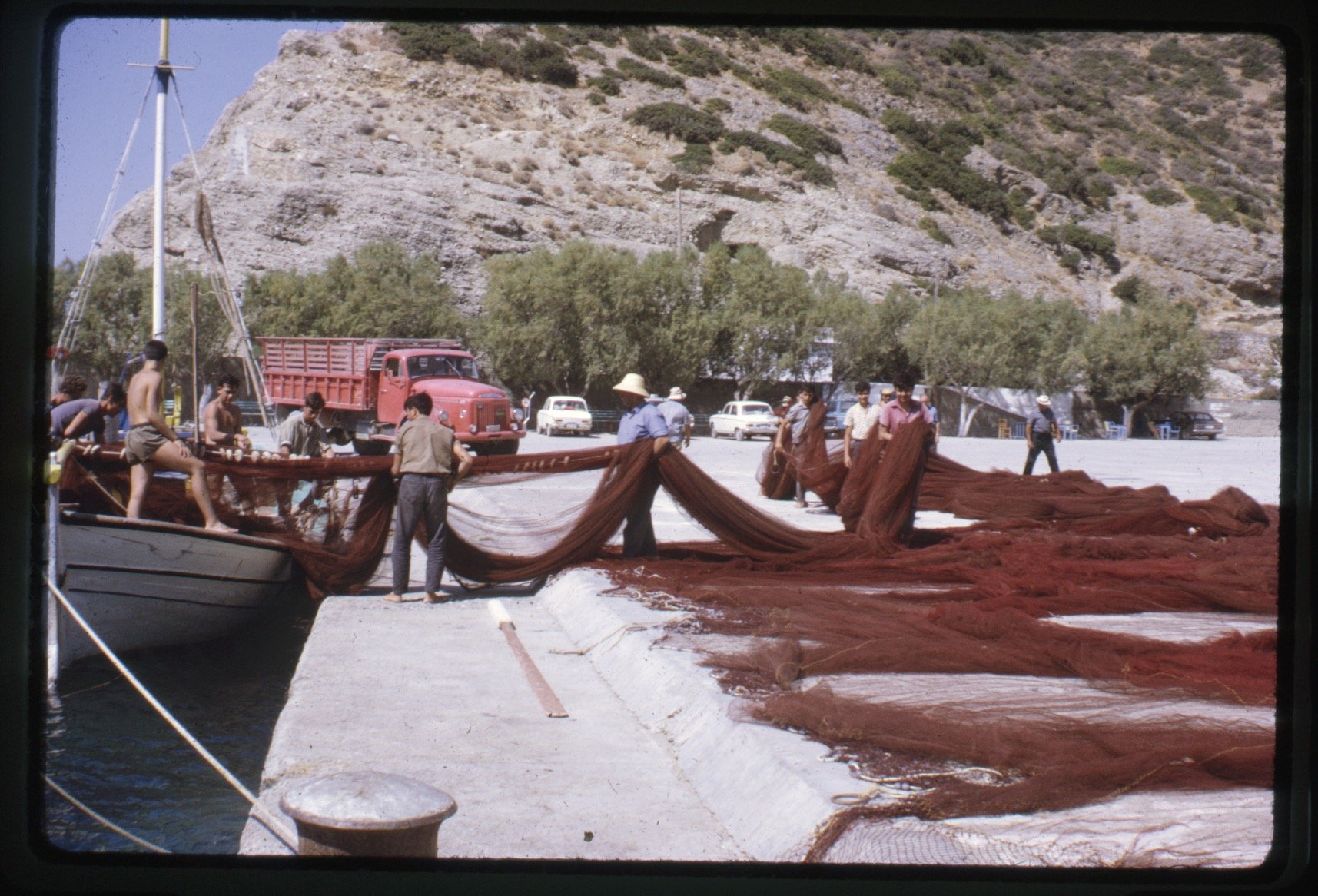 Fishermen with their nets at the harbour (1971). Photograph by Jack Whitten.