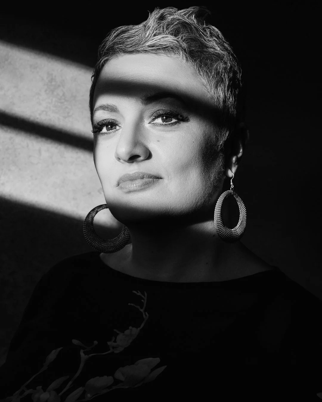 Close up portrait of a woman embracing midlife identity in a professional studio setting.