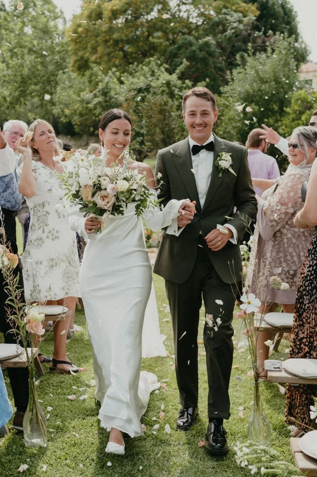 bride and groom walking back down the aisle after outdoor ceremony at Quinta de Sant'Ana Mafra Portugal