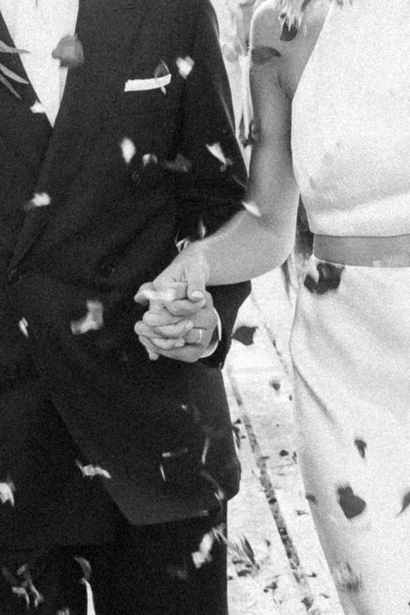bride and groom holding hands with confetti at outdoor wedding ceremony Rio do Prado Portugal