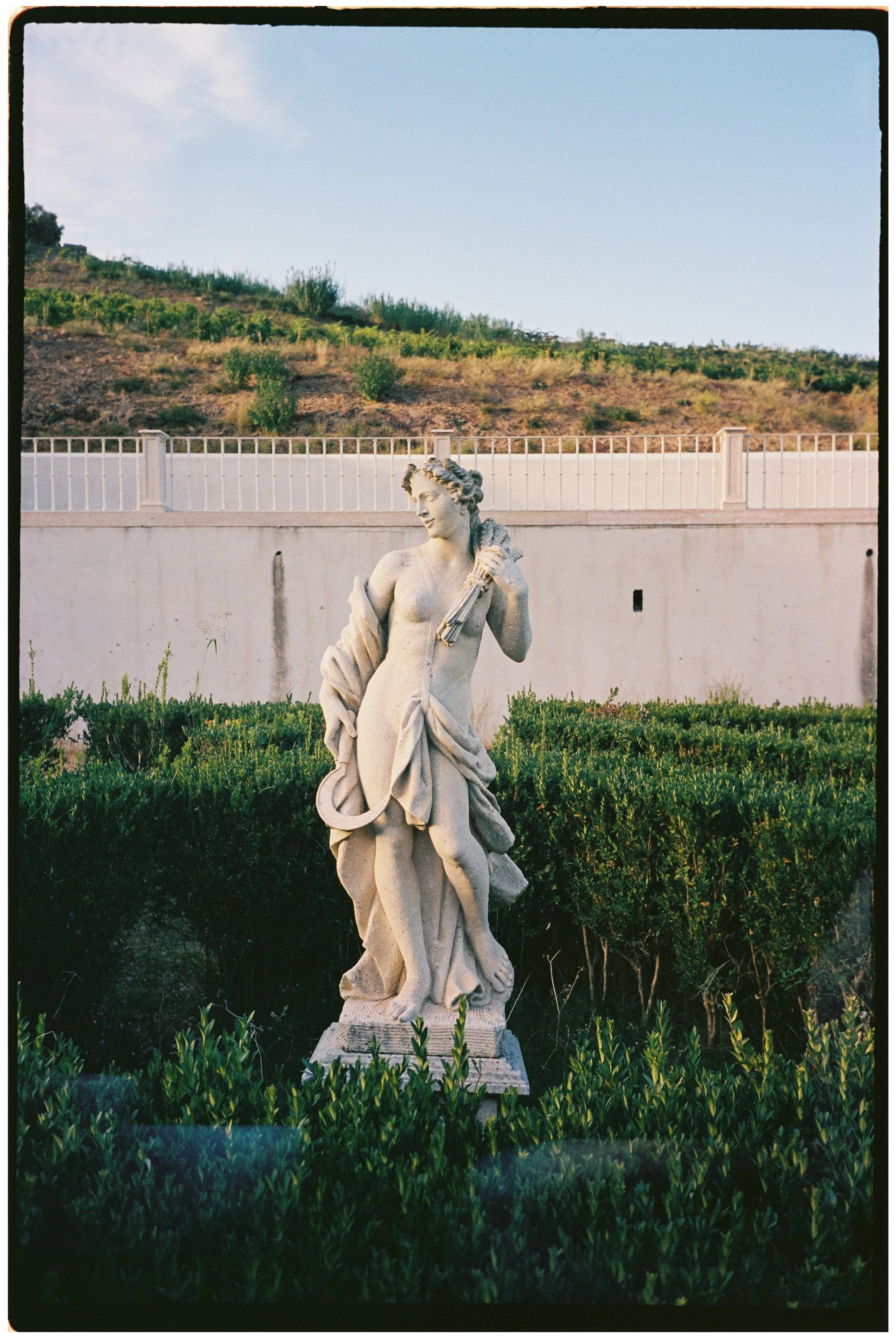 Classical statue in the gardens of Palácio do Correio-Mor, a historic wedding venue near Lisbon, Portugal.