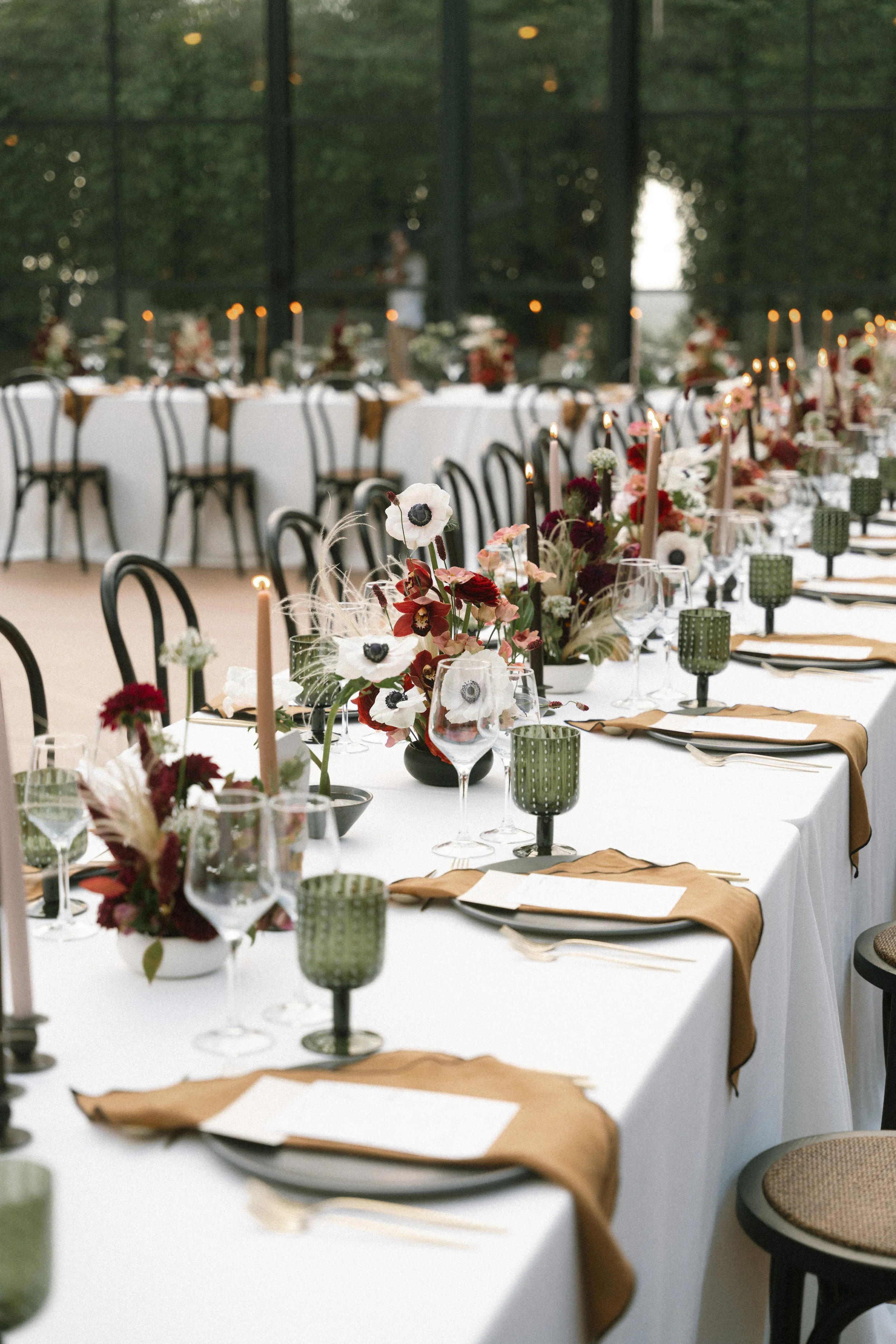 Elegant reception table with floral arrangements and candles during a luxury wedding at Seteais Palace in Sintra, Portugal.