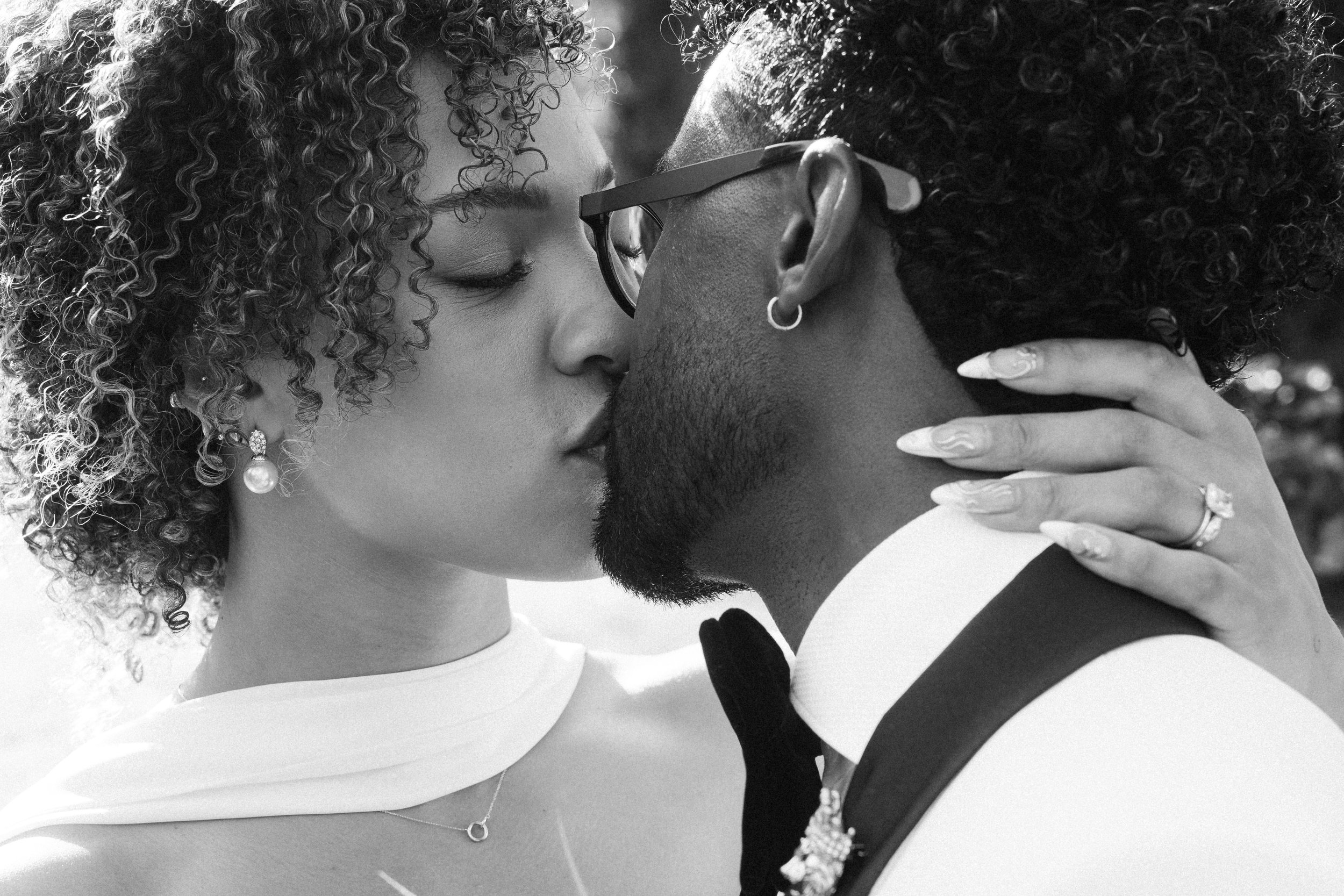 Intimate black and white portrait of a couple kissing during their wedding at Seteais Palace in Sintra, Portugal.