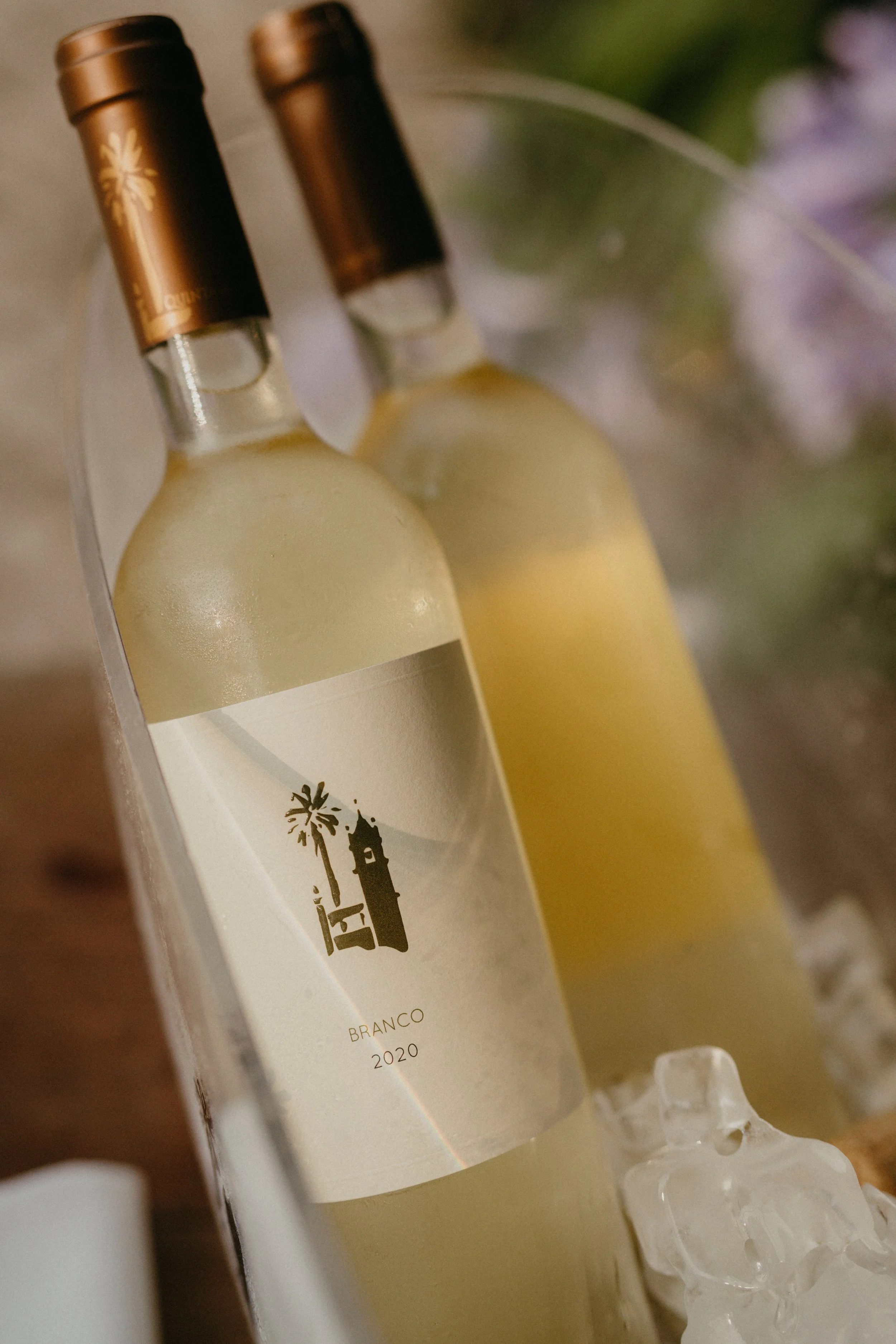 White wine bottles from Quinta de Sant’Ana served during a wedding in Mafra Portugal