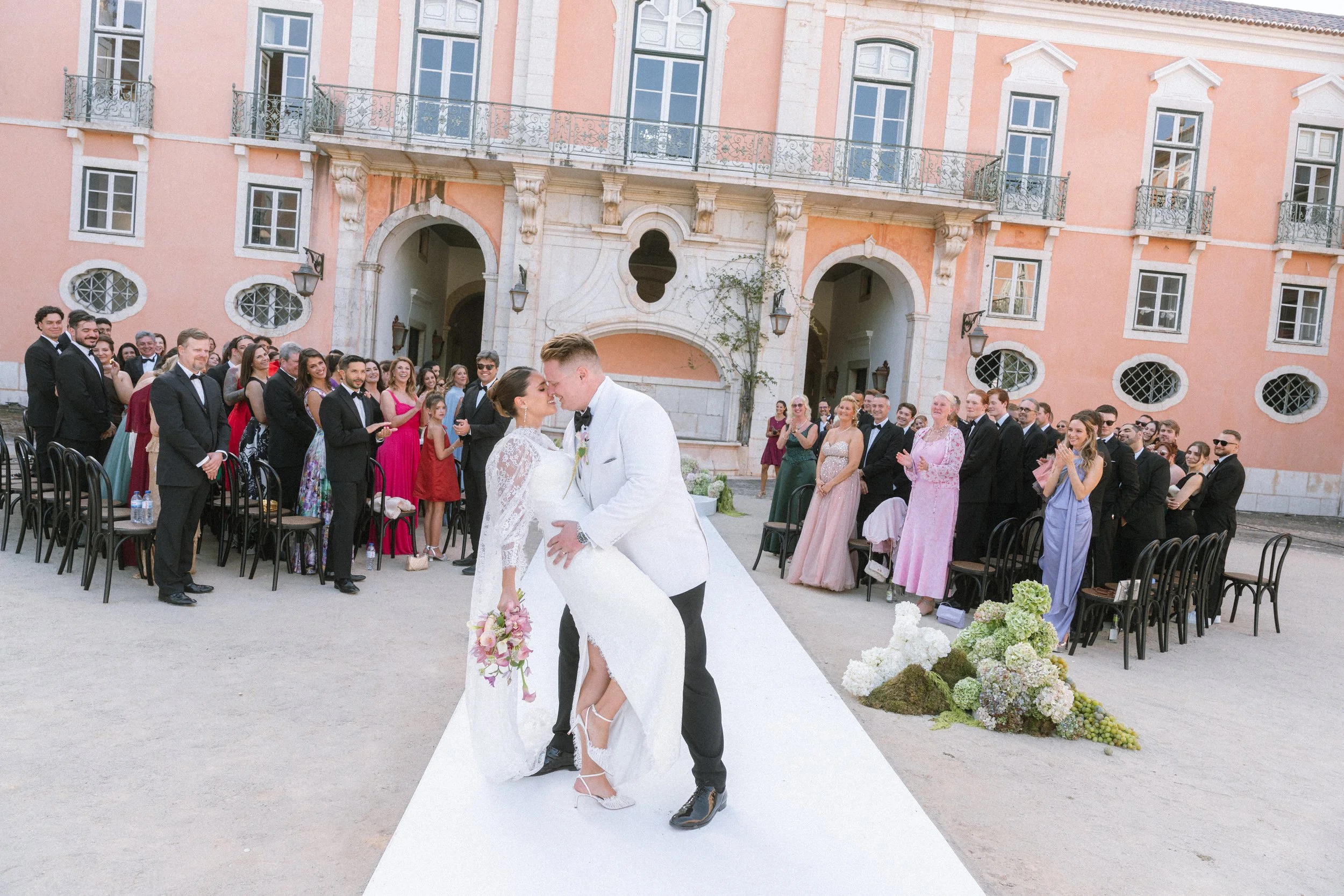 Bride and groom kissing at the end of their wedding ceremony at Palácio do Correio-Mor near Lisbon, Portugal.