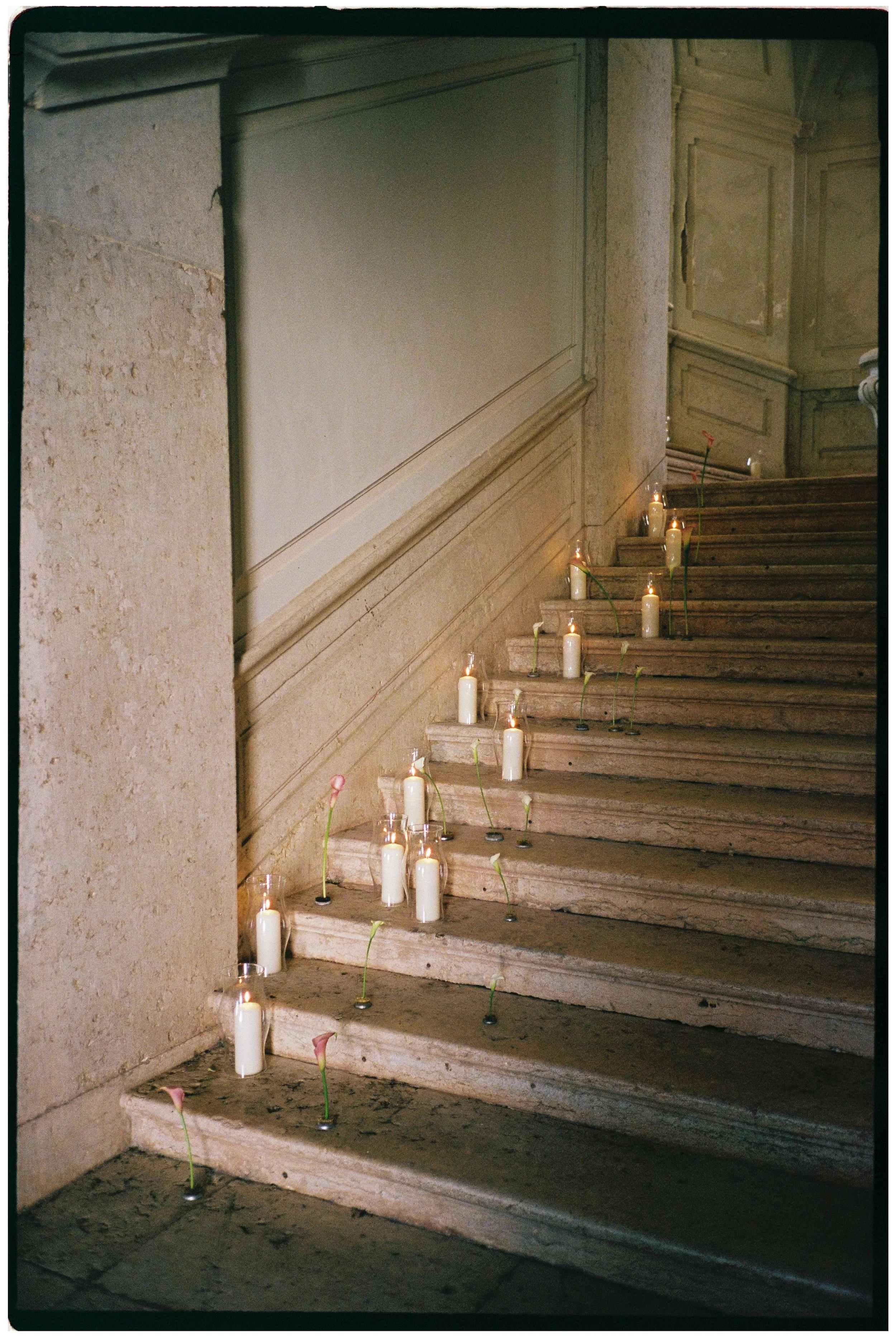 Romantic candlelit staircase decorated for a wedding at Palácio do Correio-Mor near Lisbon, Portugal.