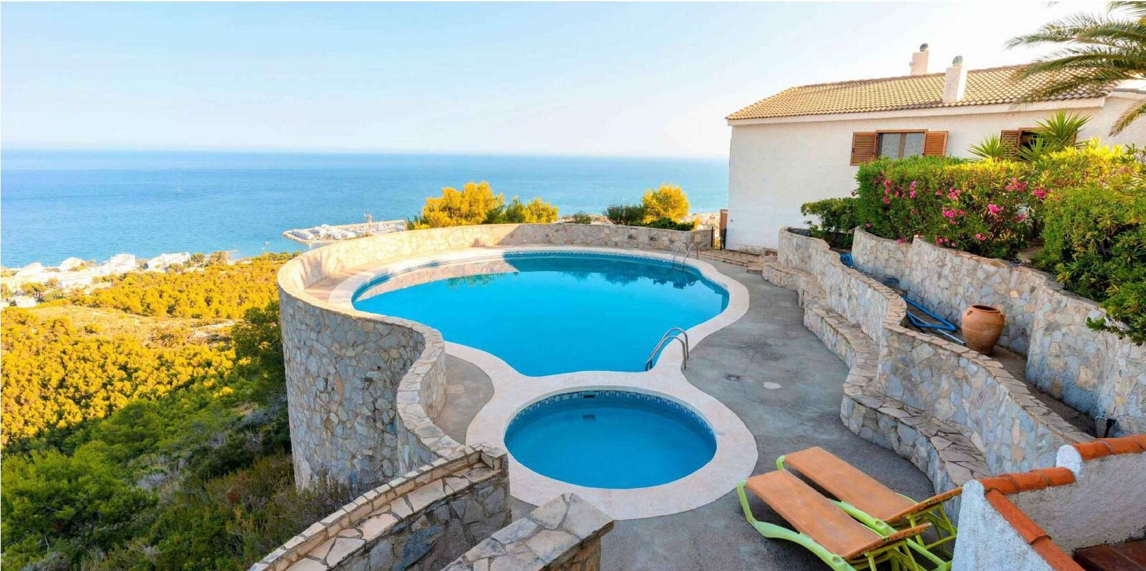 Guests relaxing in a private pool at Breizas, a luxury vacation rental