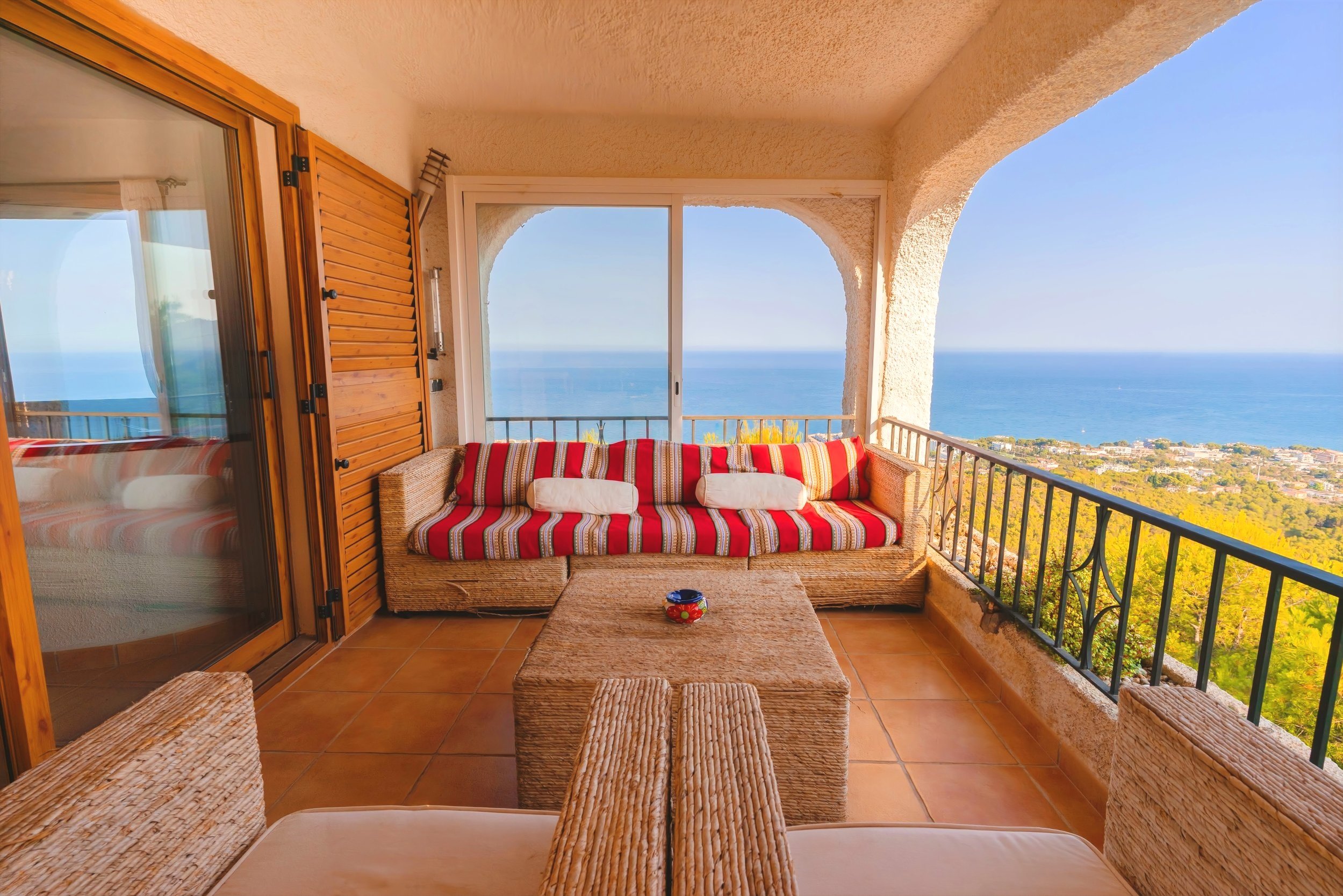 Sea view balcony with couch and table