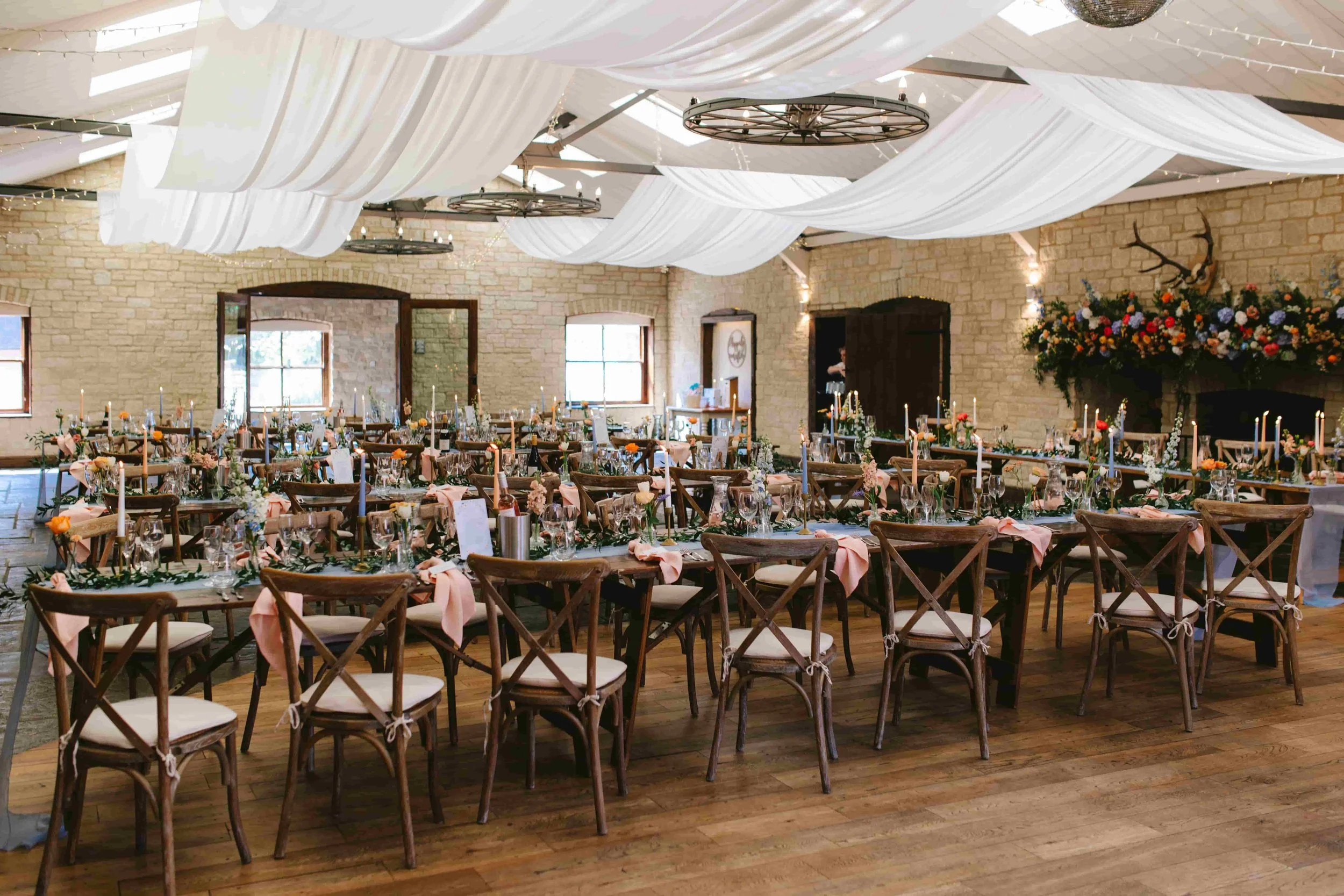 Rows of tables decorated ready for a wedding breakfast