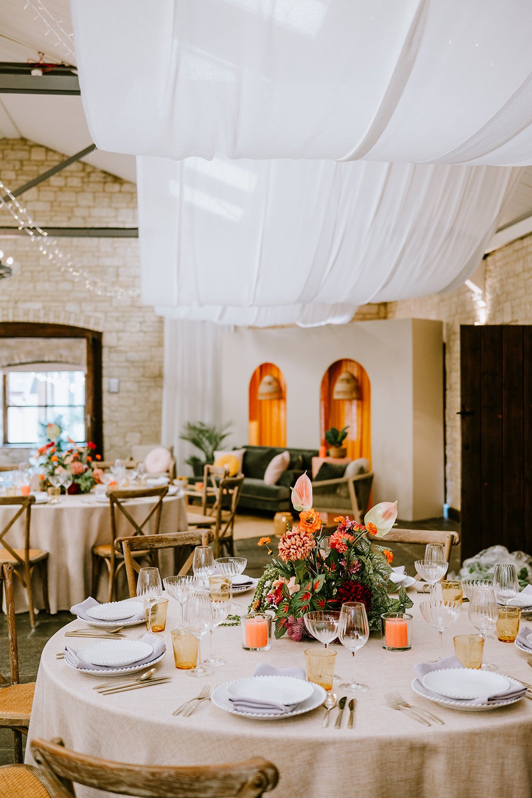 newlywed couple walking down the aisle with guests cheering