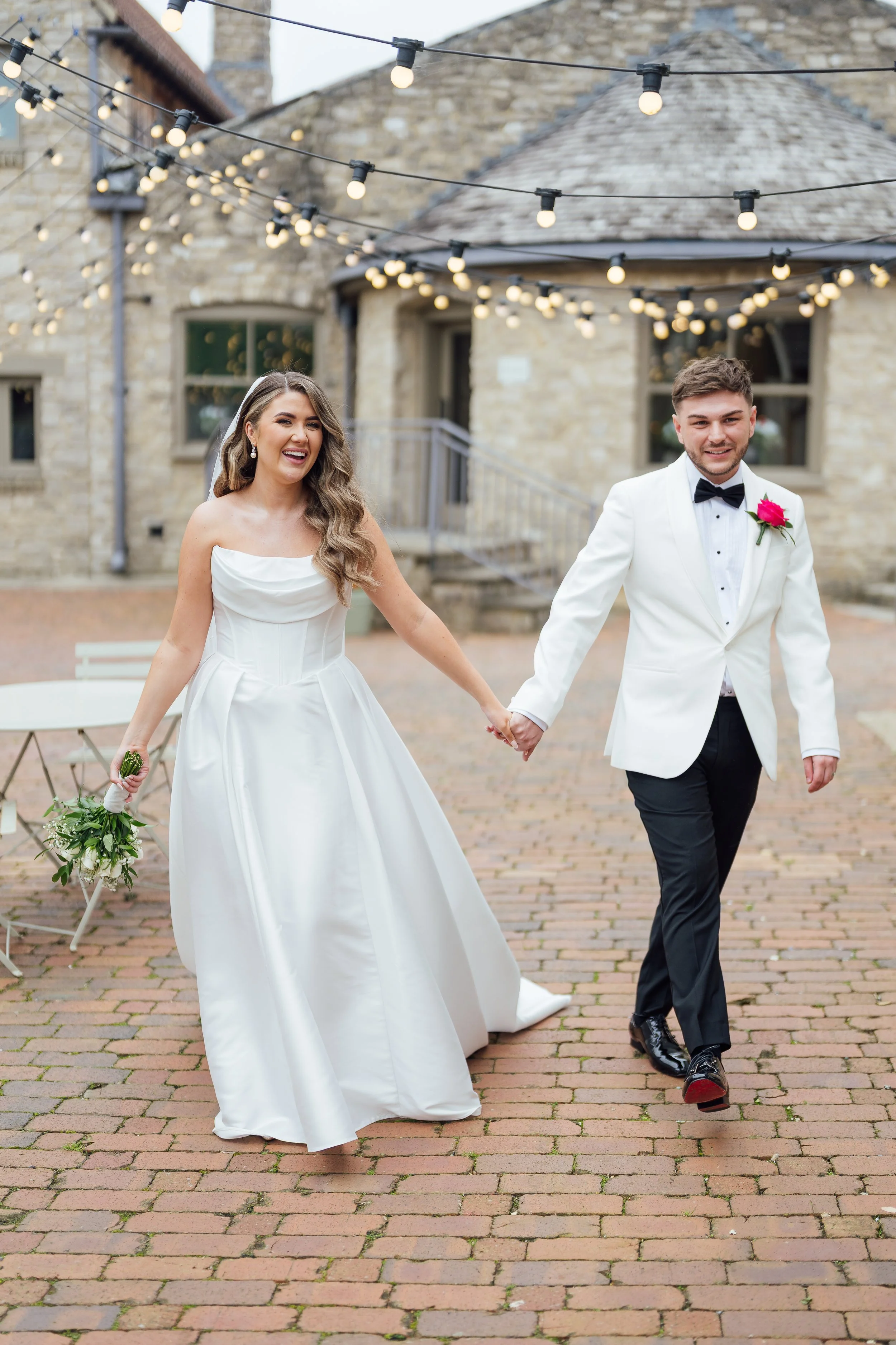 Bride walking through garden in her wedding dress