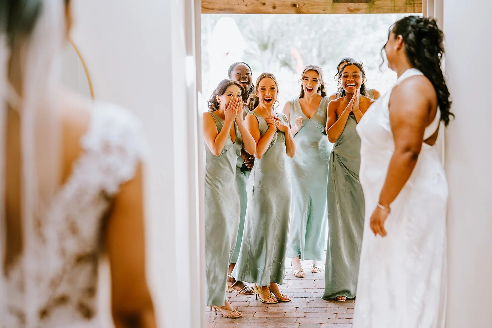 newlywed couple walking down the aisle with guests cheering