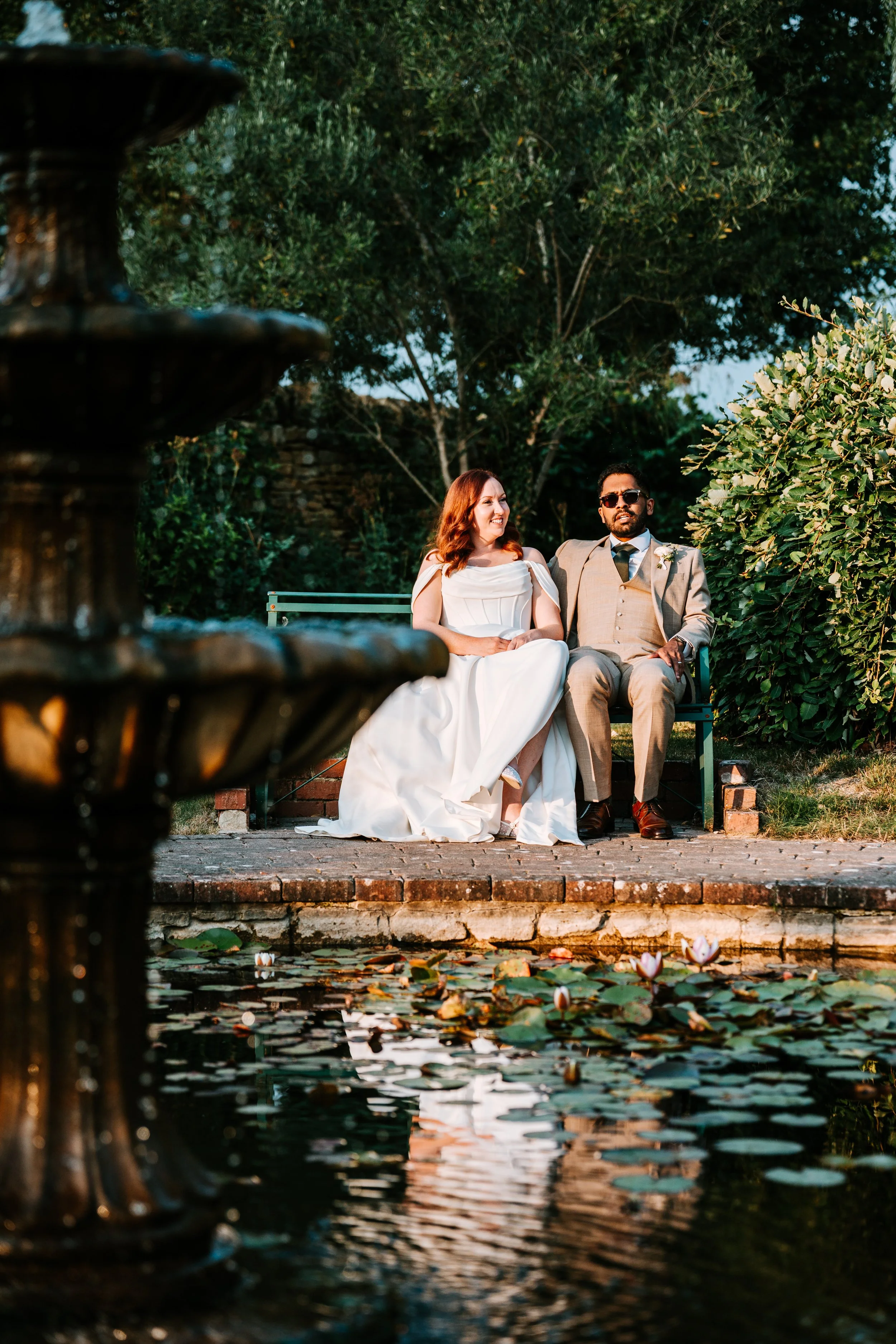 Bride walking through garden in her wedding dress