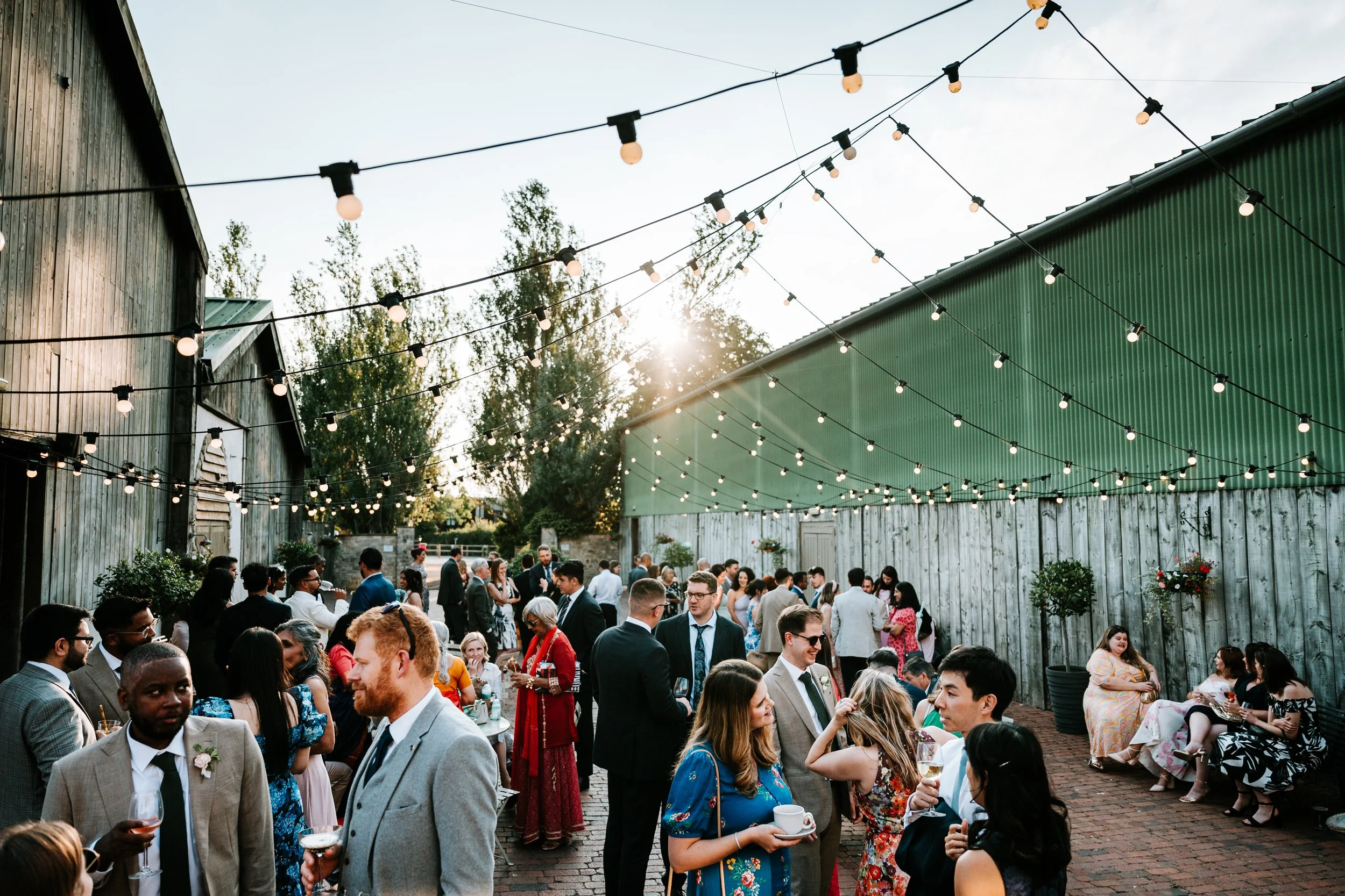newlywed couple walking down the aisle with guests cheering