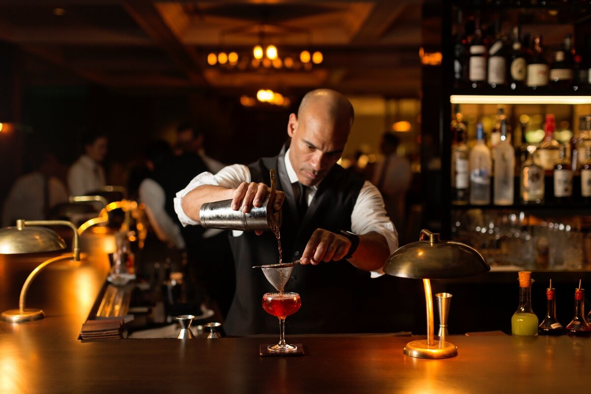 Bartender pouring a cocktail 