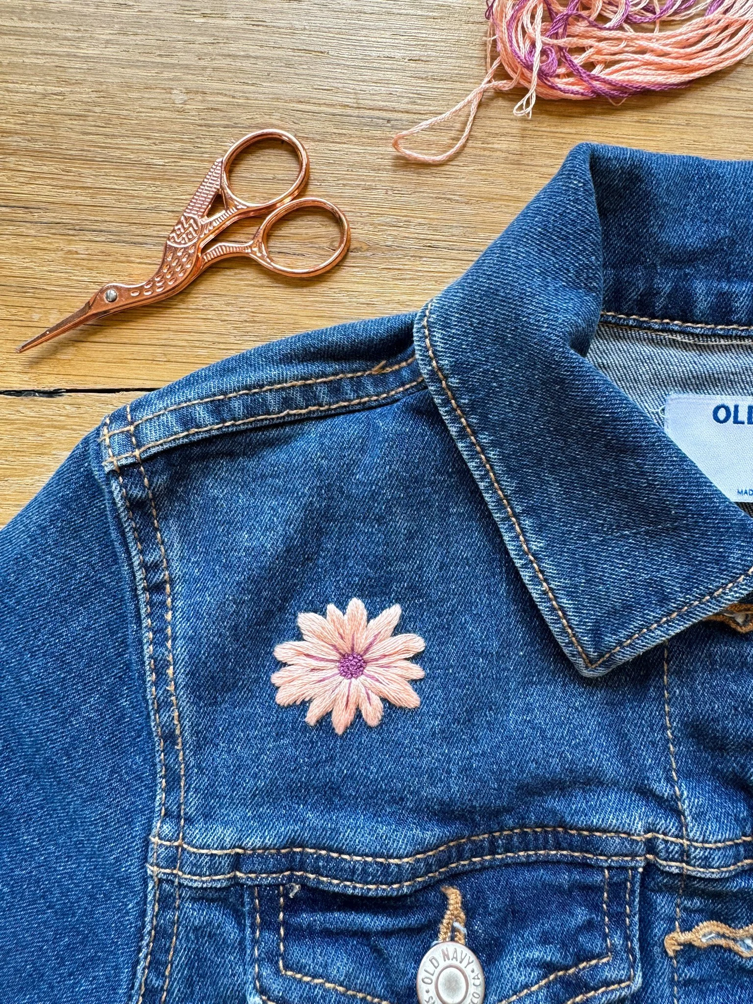 pink daisy on jean jacket.JPG