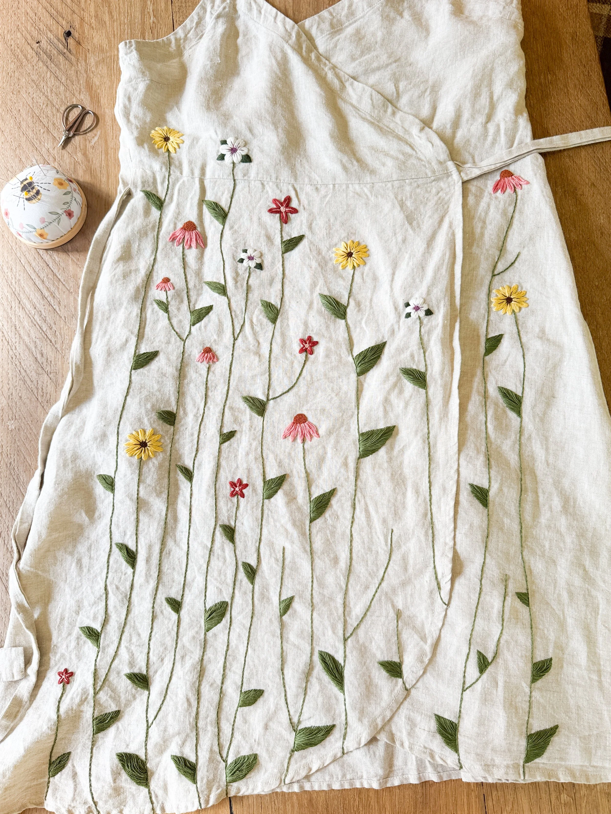 Embroidered dress with flowers and vines
