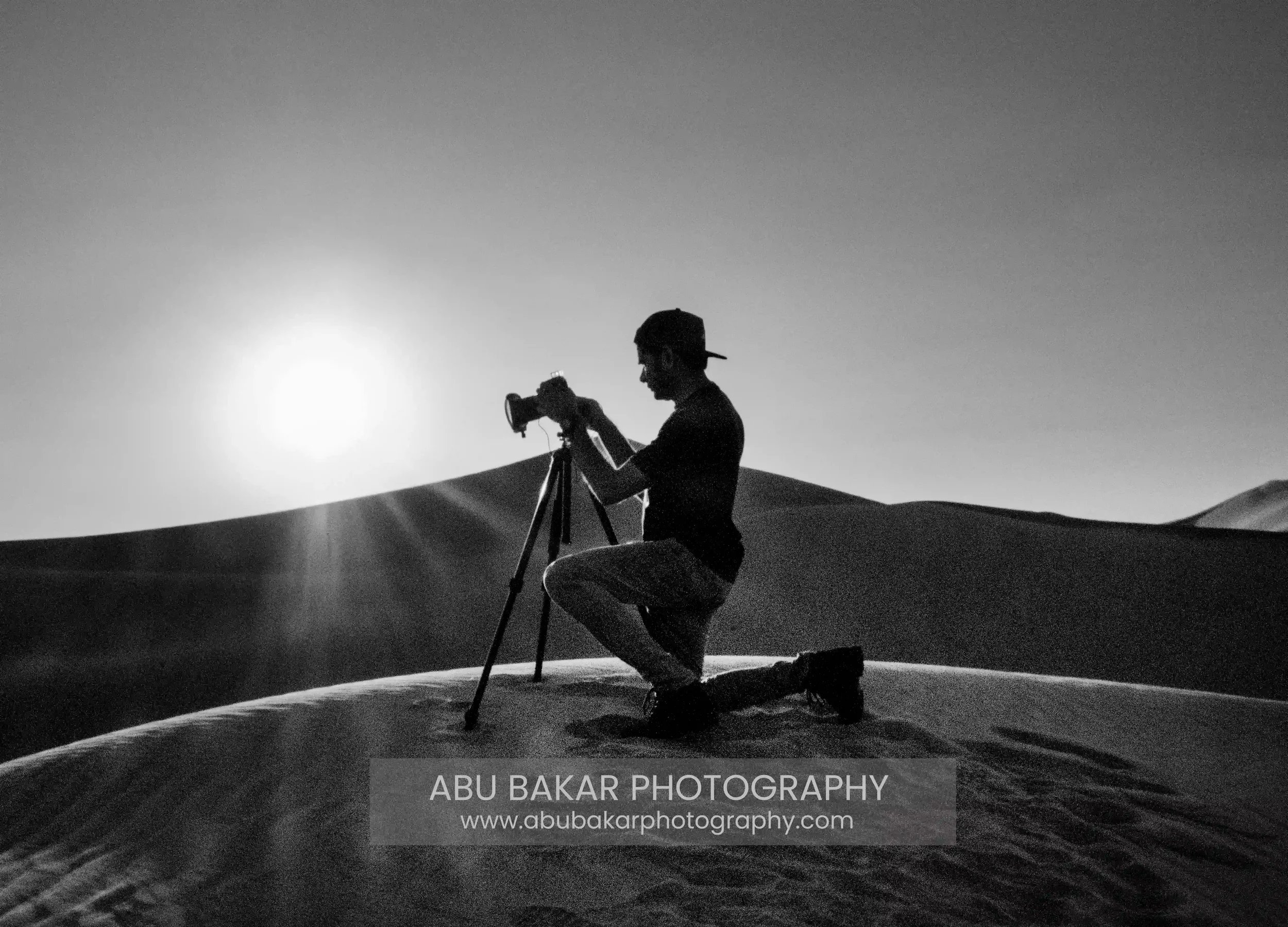 Muhammad Abu Bakar, Award winning Documentary photographer based in the UAE taking photo of the Liwas\ Desert.