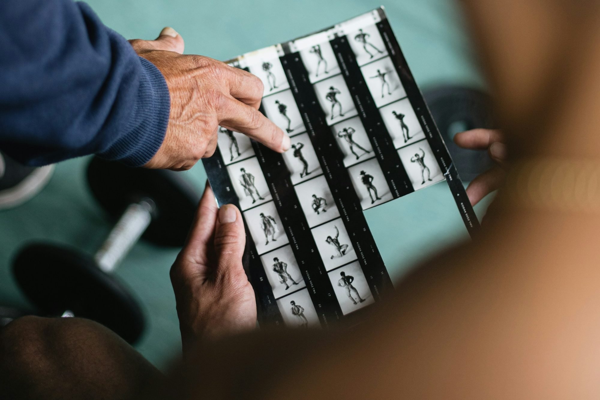 Choosing safe exercises for osteoporosis, reviewing a printed program in a gym