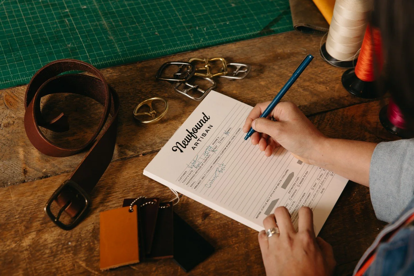 Step inside @newfoundartisan on Jordan Street in downtown Brevard, where creativity, craftsmanship, and community come together. Husband-and-wife duo Doug and Emma create handcrafted leather and metal pieces right in their shop, alongside work from t