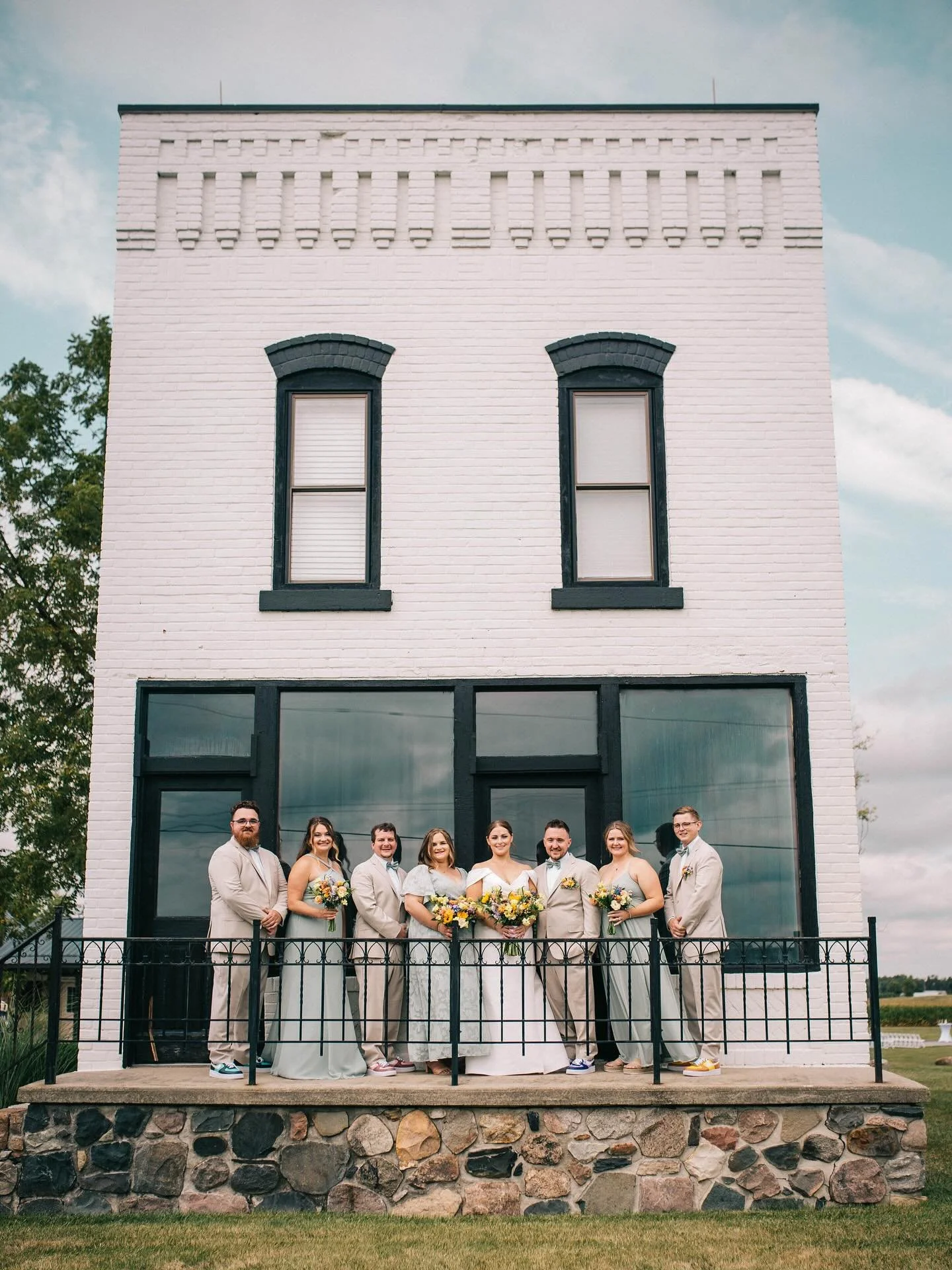Bridal party looking picture-perfect in front of a timeless backdrop&mdash; the Post Office. Every angle of this building gets you a different look and unique photo. ✨