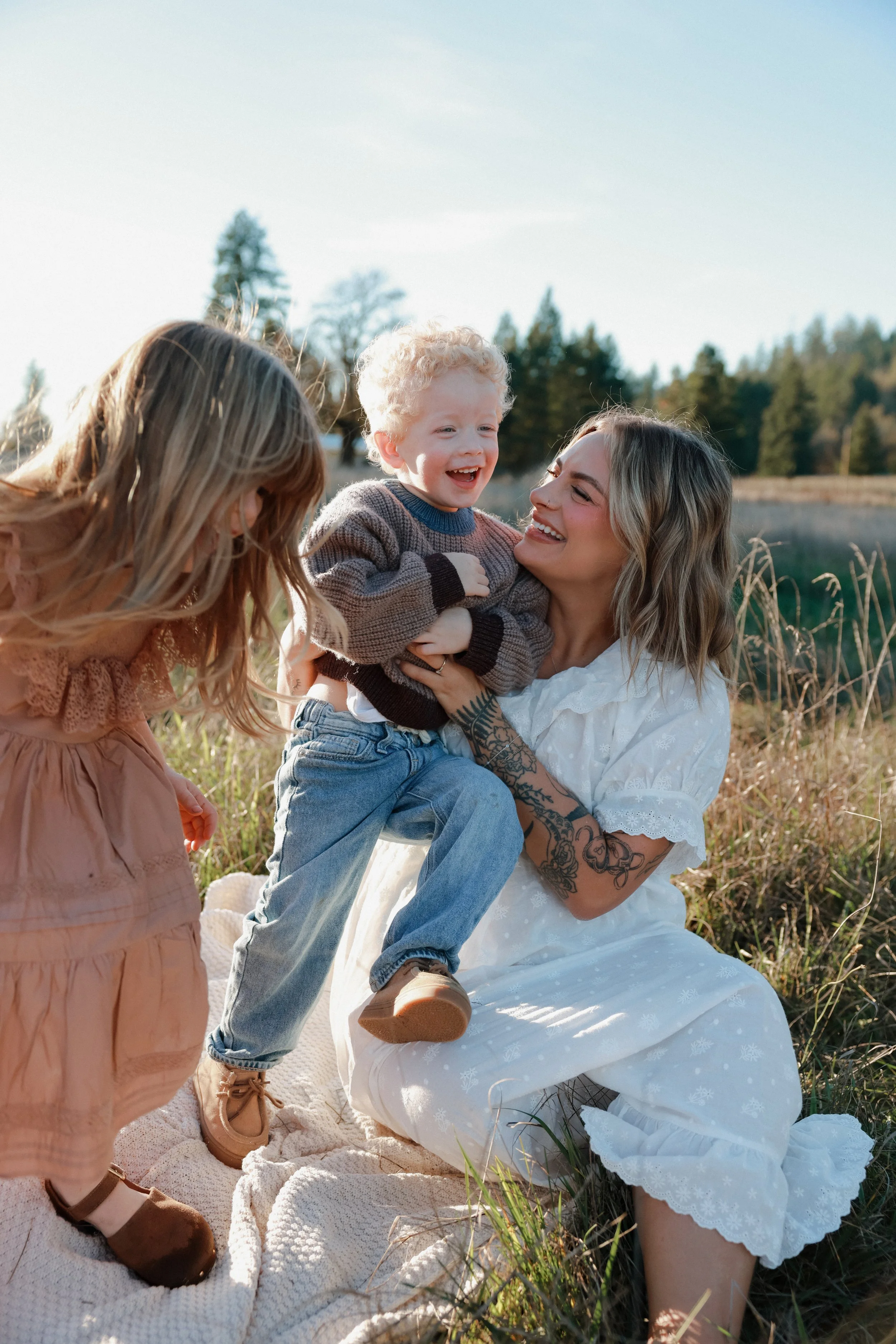 mama and her babies in a field