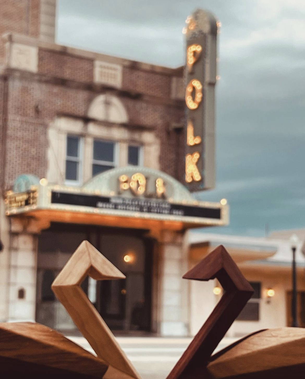 wooden swans in front of the Polk Theatre