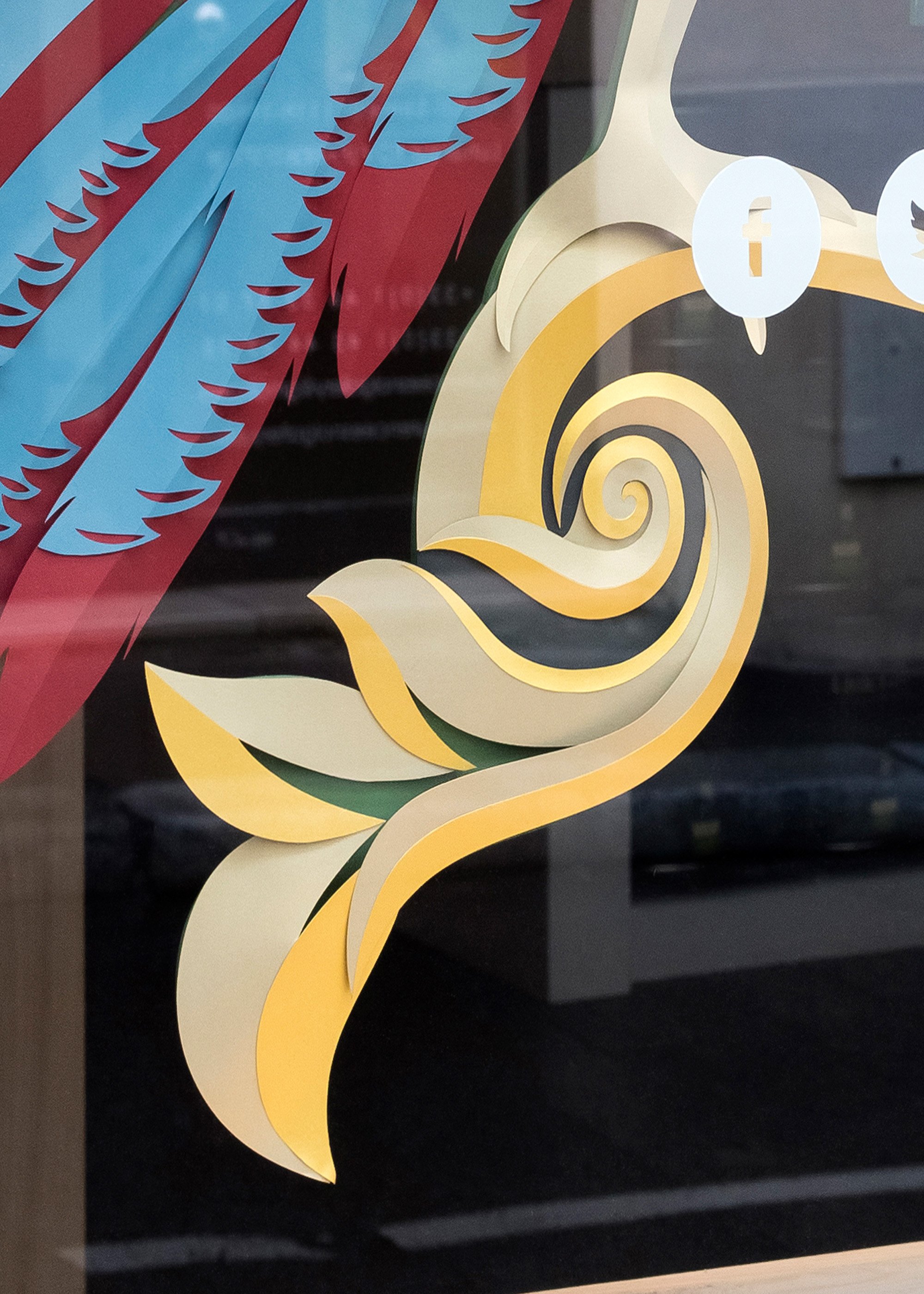 Detail of layered paper tail and scroll, Bird of Paradise window display