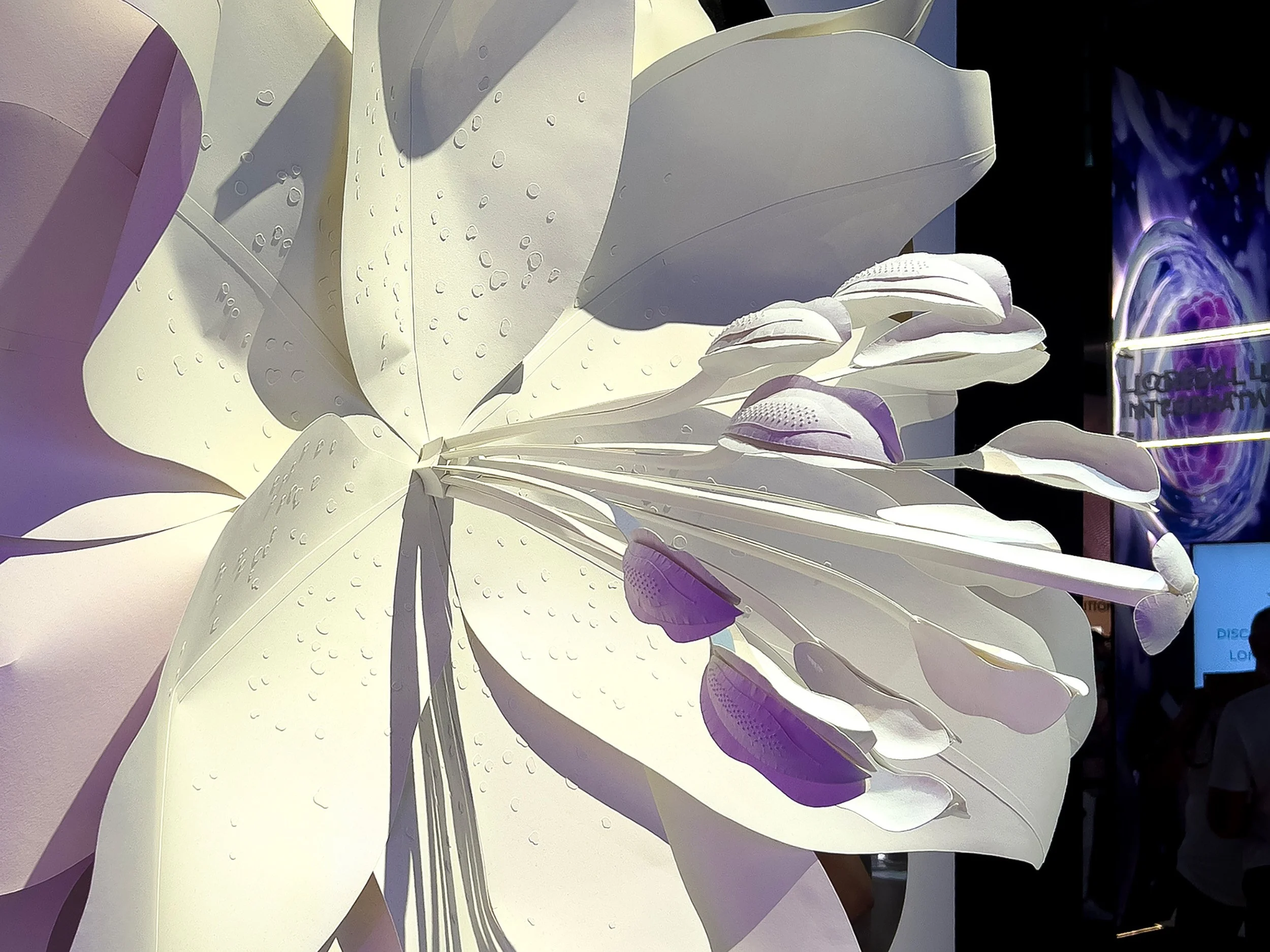 Detail of handcrafted paper stamens and textured petals inspired by augmented nature.