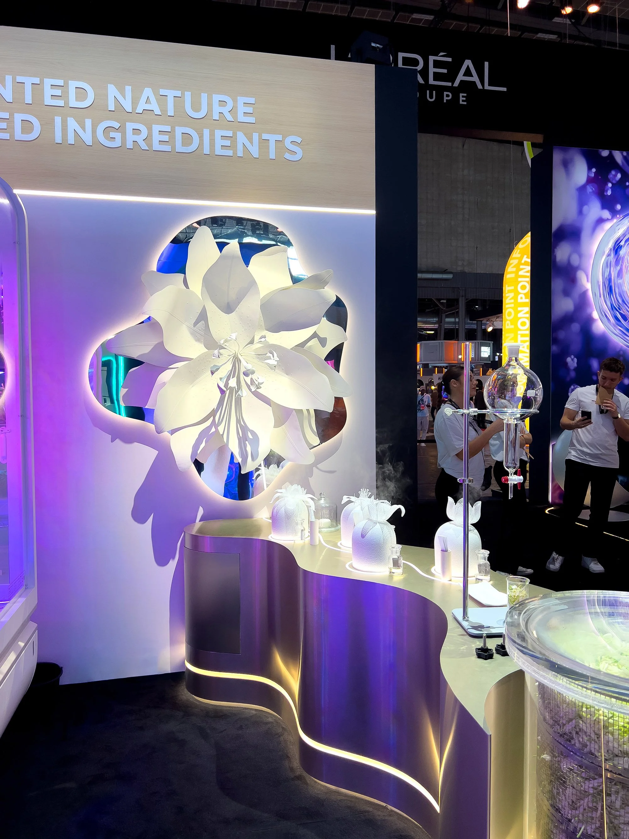Large illuminated paper flower installation inspired by augmented nature.