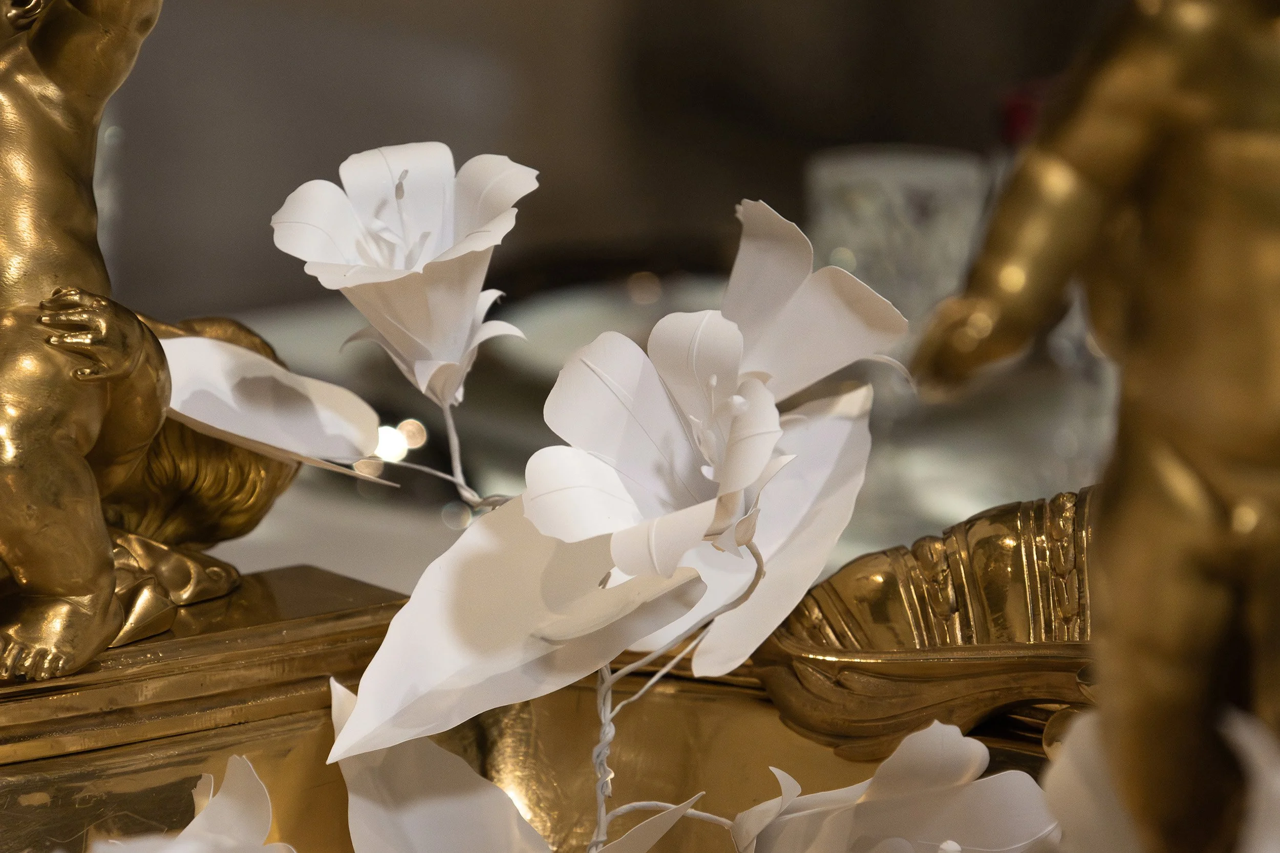 White paper bindweed flowers intertwining with gilded cherubs on the Christofle central jardinière, Musée des Arts Décoratifs, Paris.