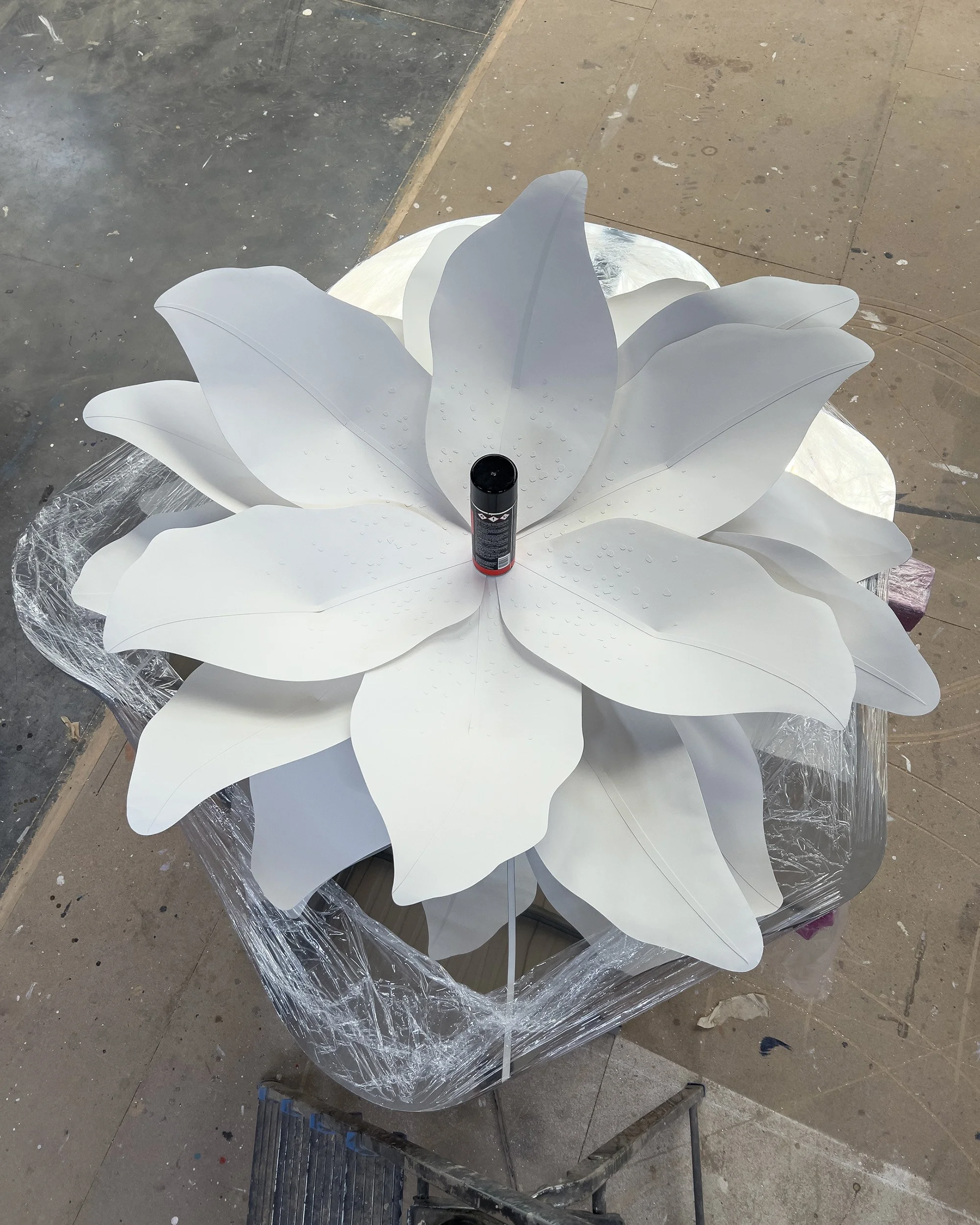 Botanical paper installation before the assembly of the central flower structure and stamens.
