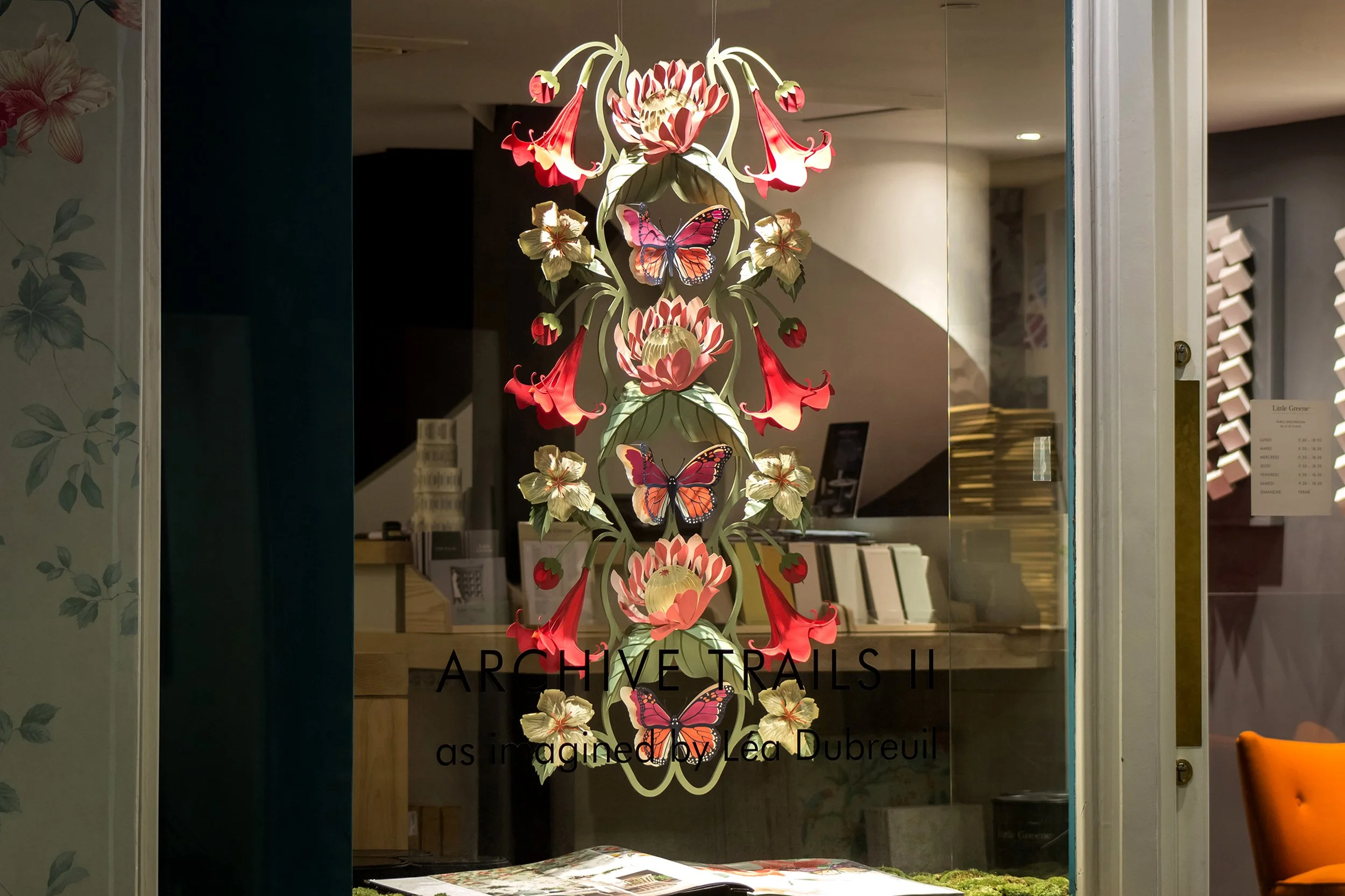 Hand-painted paper floral installation inspired by Little Greene's Asterid wallpaper pattern, Paris showroom window display