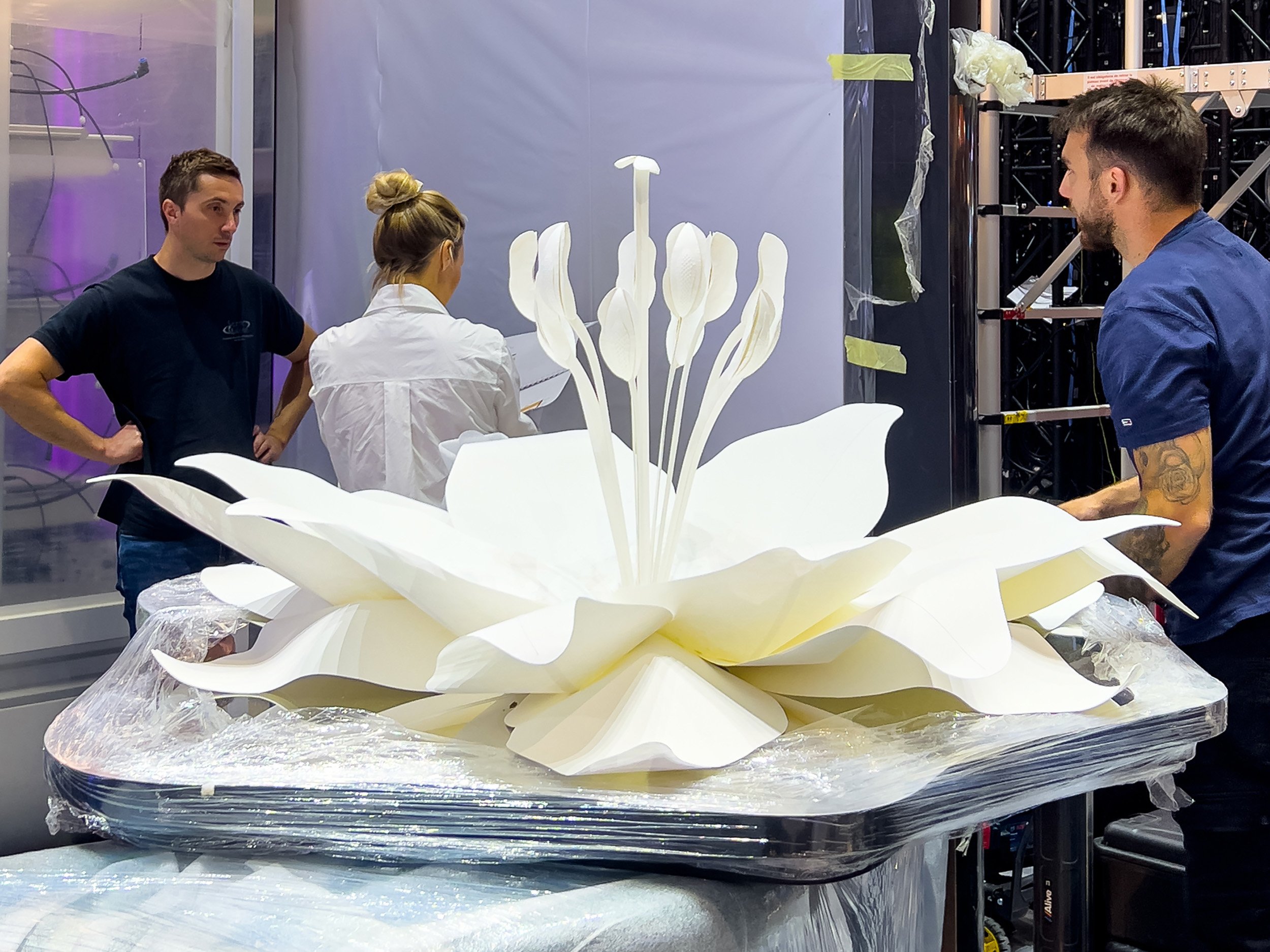 Installation of the large botanical paper sculpture on L'Oréal Group's Vivatech exhibition stand.