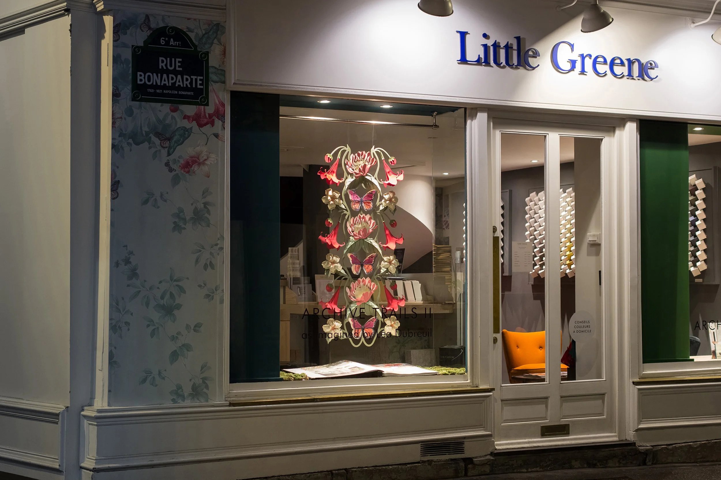 Illuminated paper floral installation displayed in the Little Greene Paris showroom during Paris Déco Off