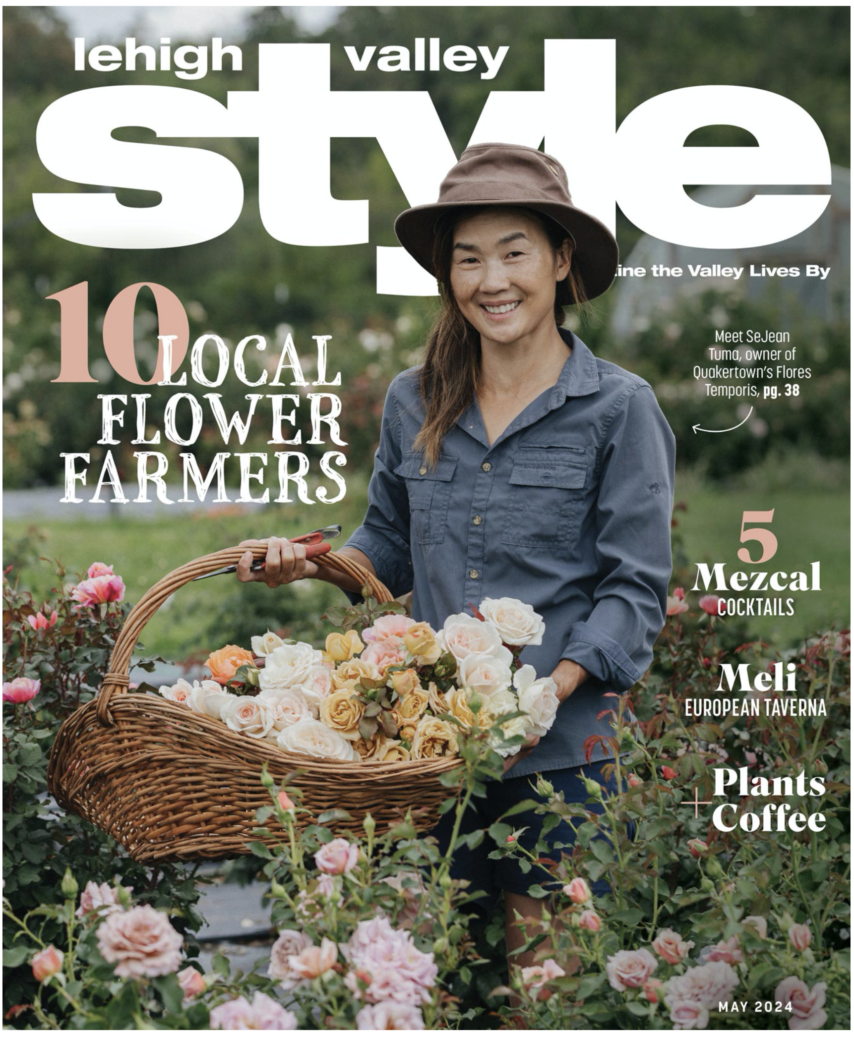 Woman smiling in a garden holding a basket of roses, surrounded by blooming rose bushes, on the cover of a magazine titled 'Lehigh Valley Style' from May 2024.