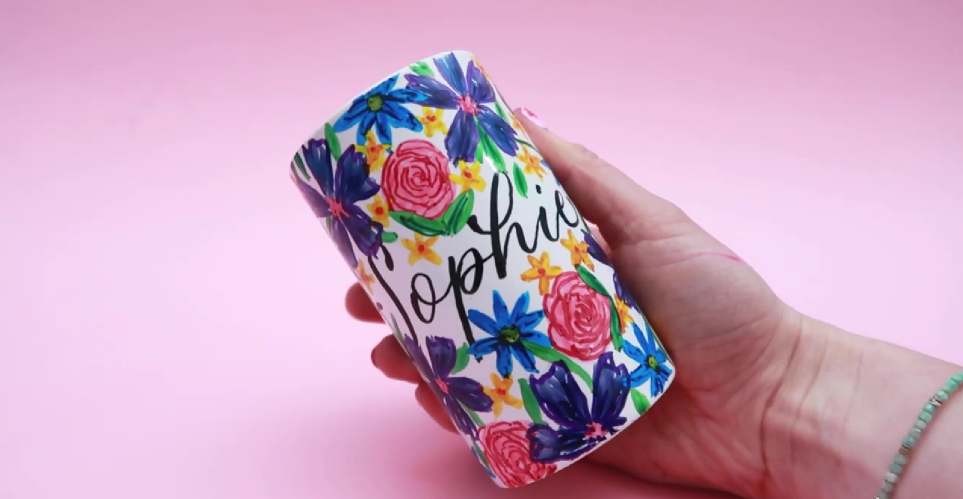 Completed personalised floral ceramic pen pot after baking with vibrant colours and detailed design