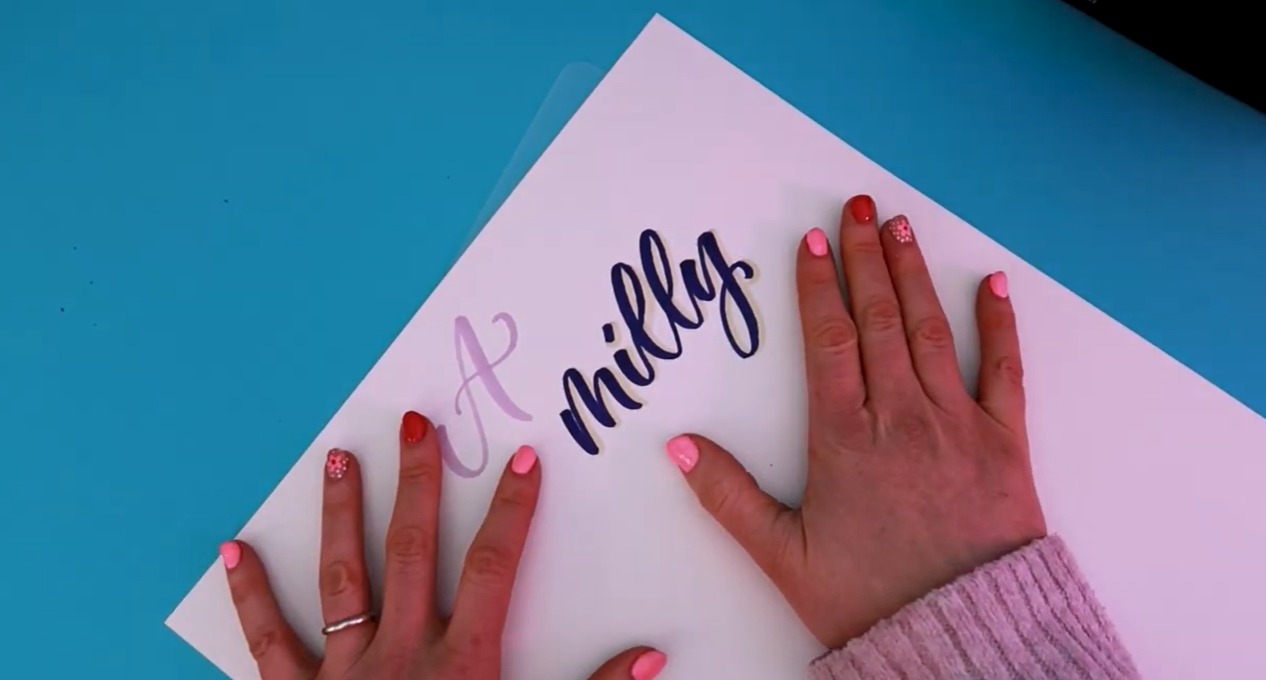 A calligraphy word written on Winsor & Newton Bristol board using an Ohuhu marker, demonstrating clean minimal bleeding