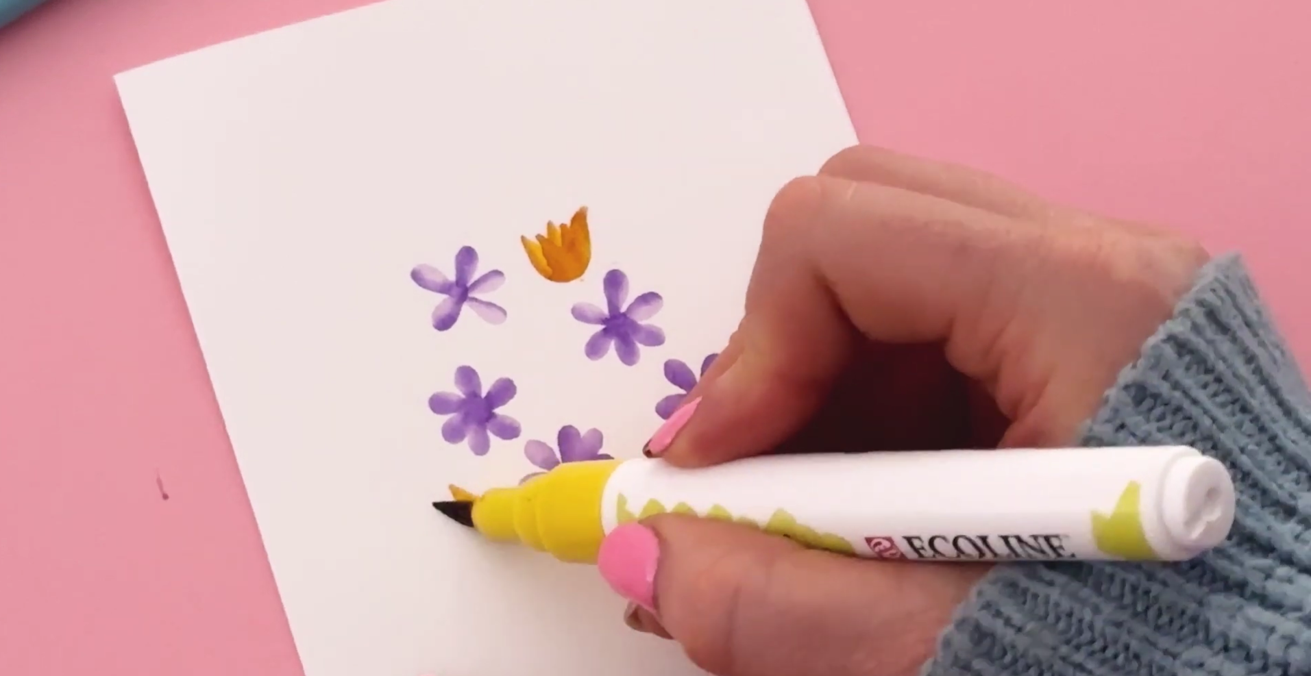 Adding warm-toned brush pen flowers to a floral bouquet