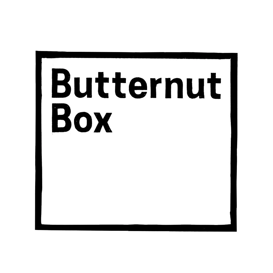 Black-and-white sign with the text "Butternut Box" inside a square border.