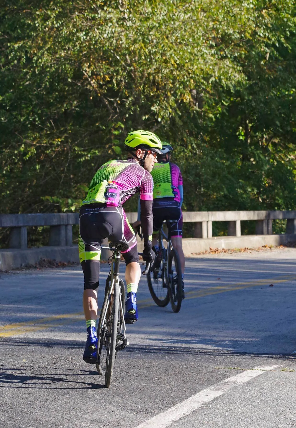 The Boss Man and I (sorry for my non-matching shoe covers) going for a pre-ride spin.  By Boss Man I mean he’s the sponsor of our “team”.  If you need a beautiful house built in Winston-Salem call Duane at Henderson Custom Homes.Photo Credit: Patty …